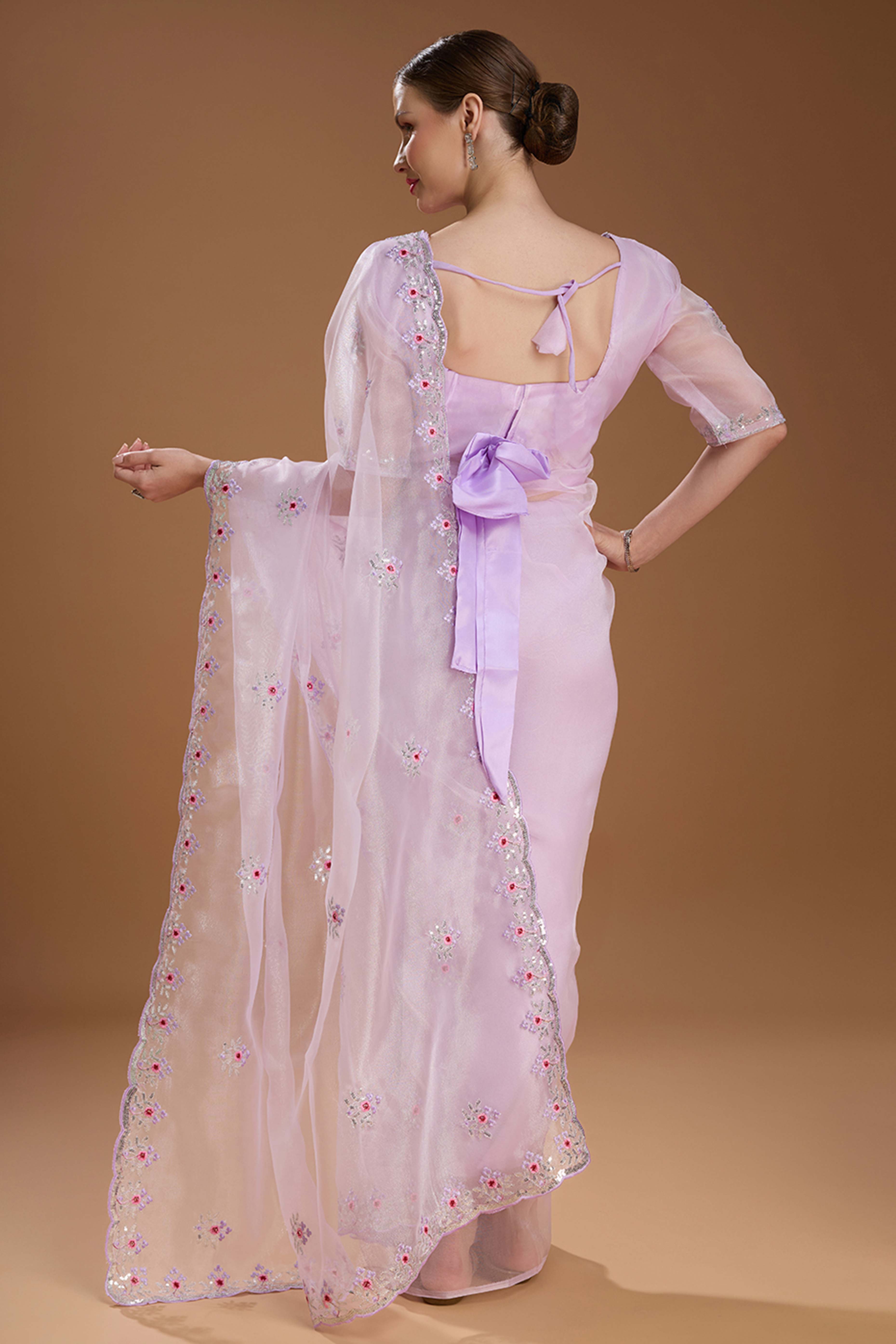 Light Lavender Net Saree Enhanced with Elegant Sequins Embellishments