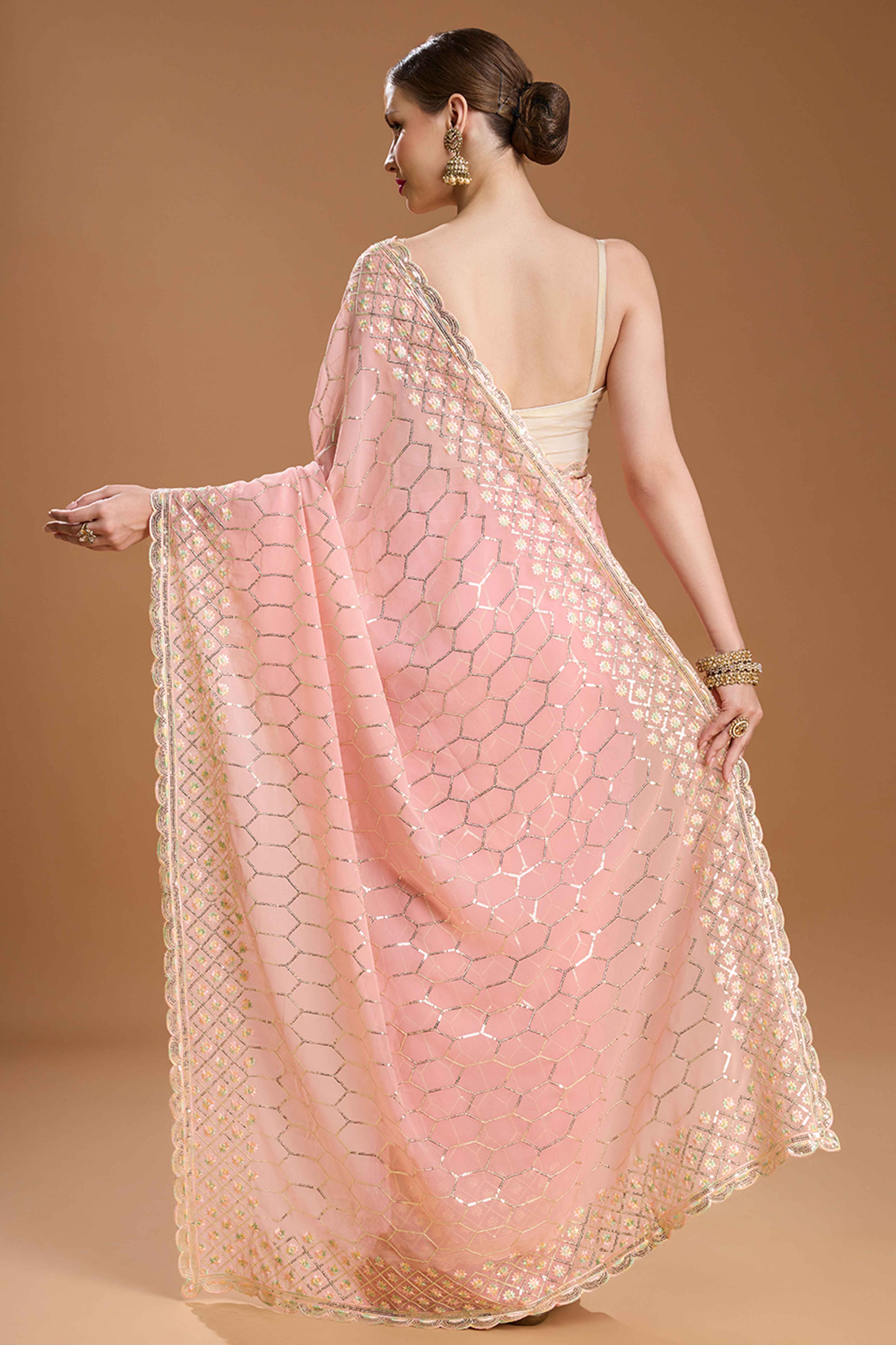Pastel Peach Georgette Saree Enhanced with Elegant Sequins Embellishments