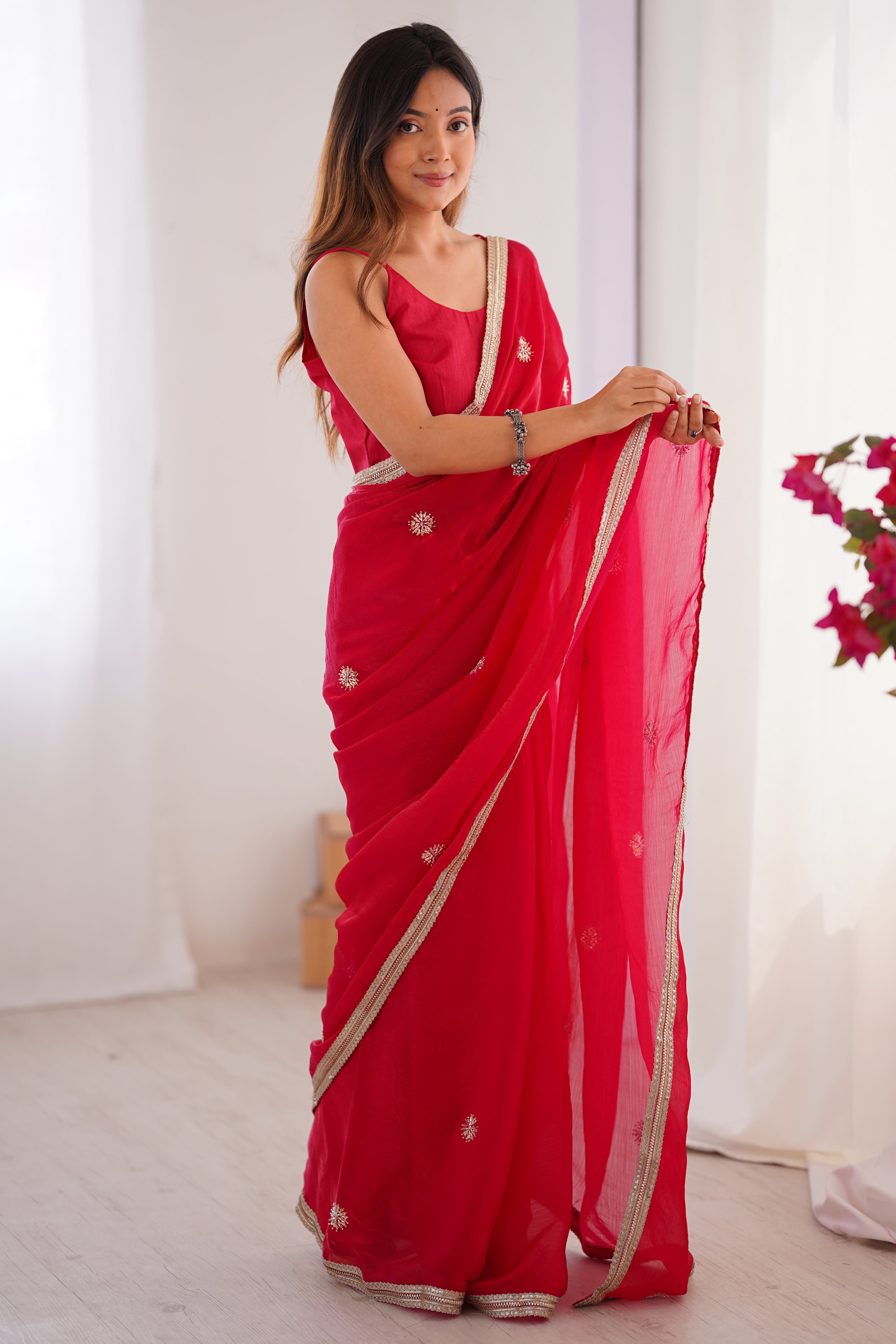 Elegant Red Organza Saree with Delicate Floral Embellishments and Lace Border