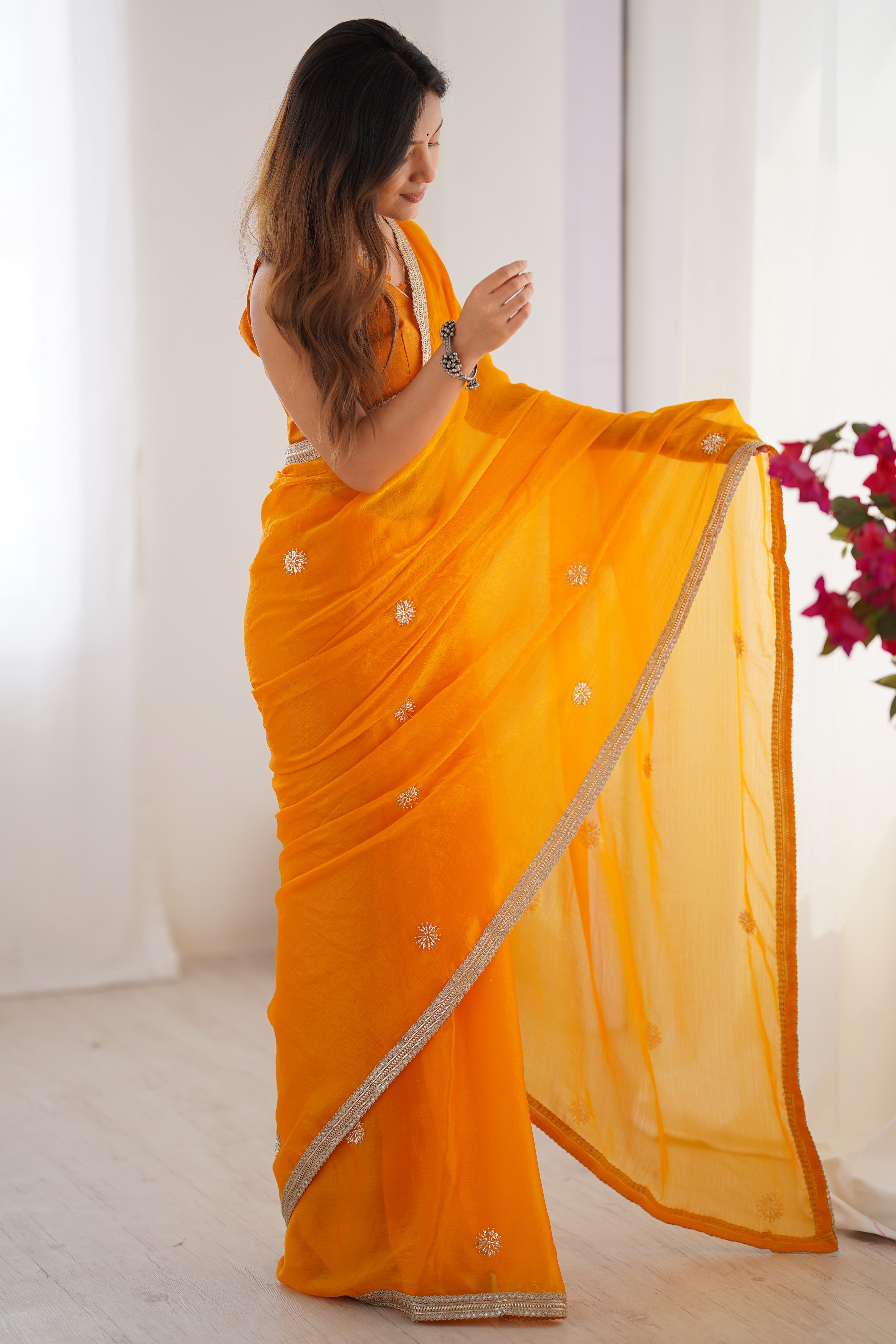 Elegant Mustard Yellow Organza Saree with Delicate Floral Embellishments and Lace Border