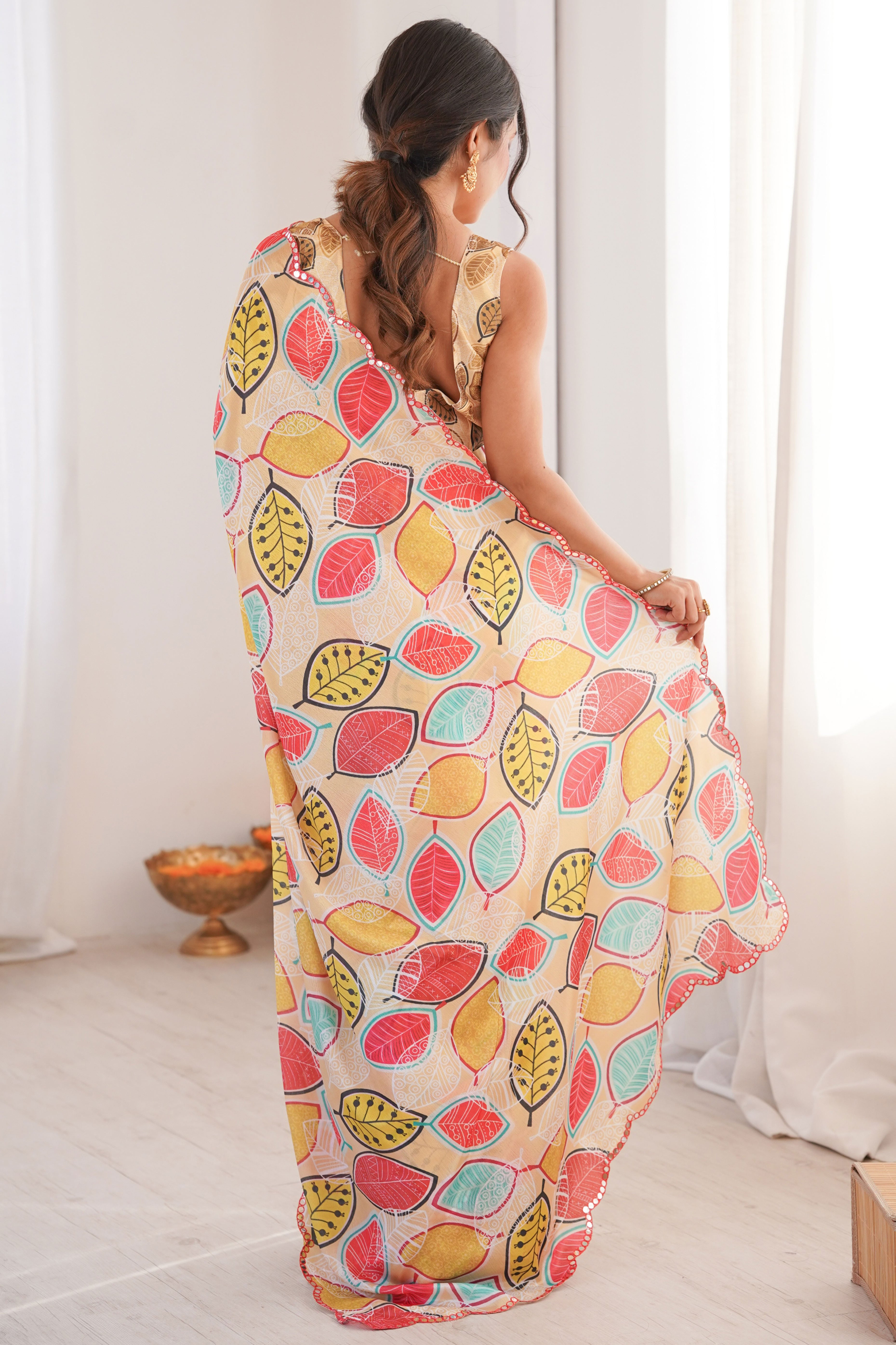 Sophisticated Light Yellow Leaf Digital Printed Chinon Saree Highlighted By Embroidered Border