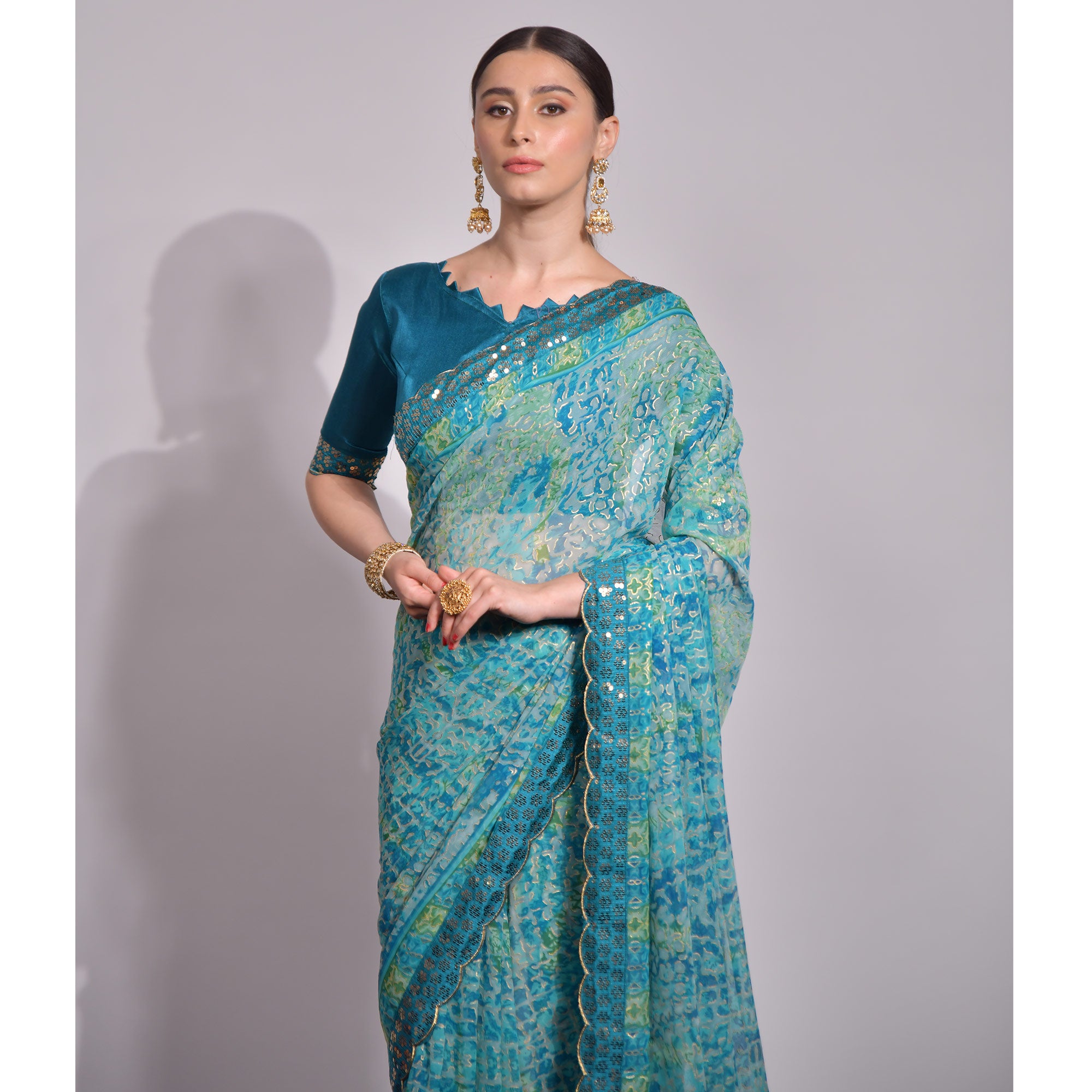 Blue Foil Printed Chiffon Saree With Embroidered Border