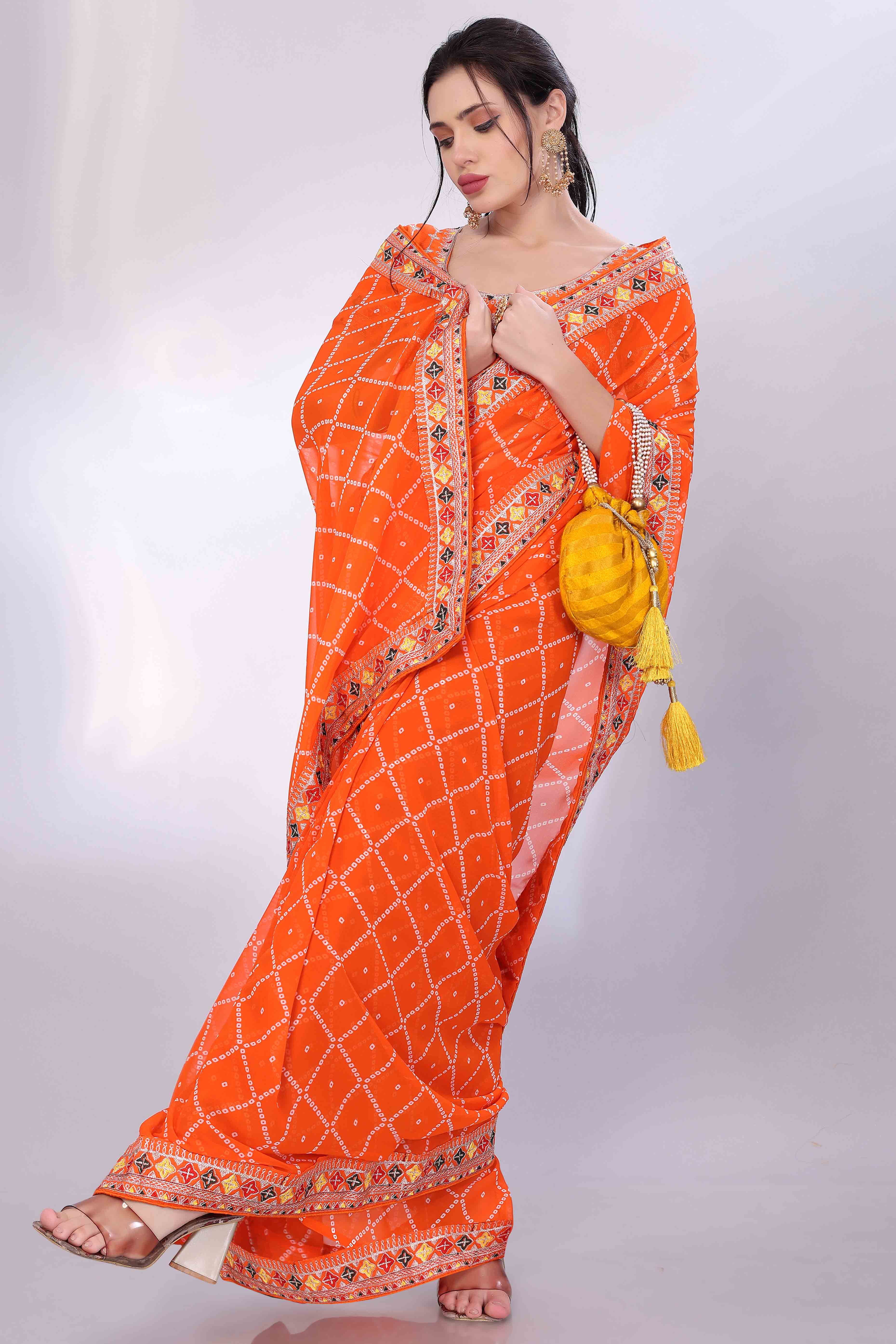 Orange Bandhani Printed Georgette Saree Framed With Elegant Embroidered Border