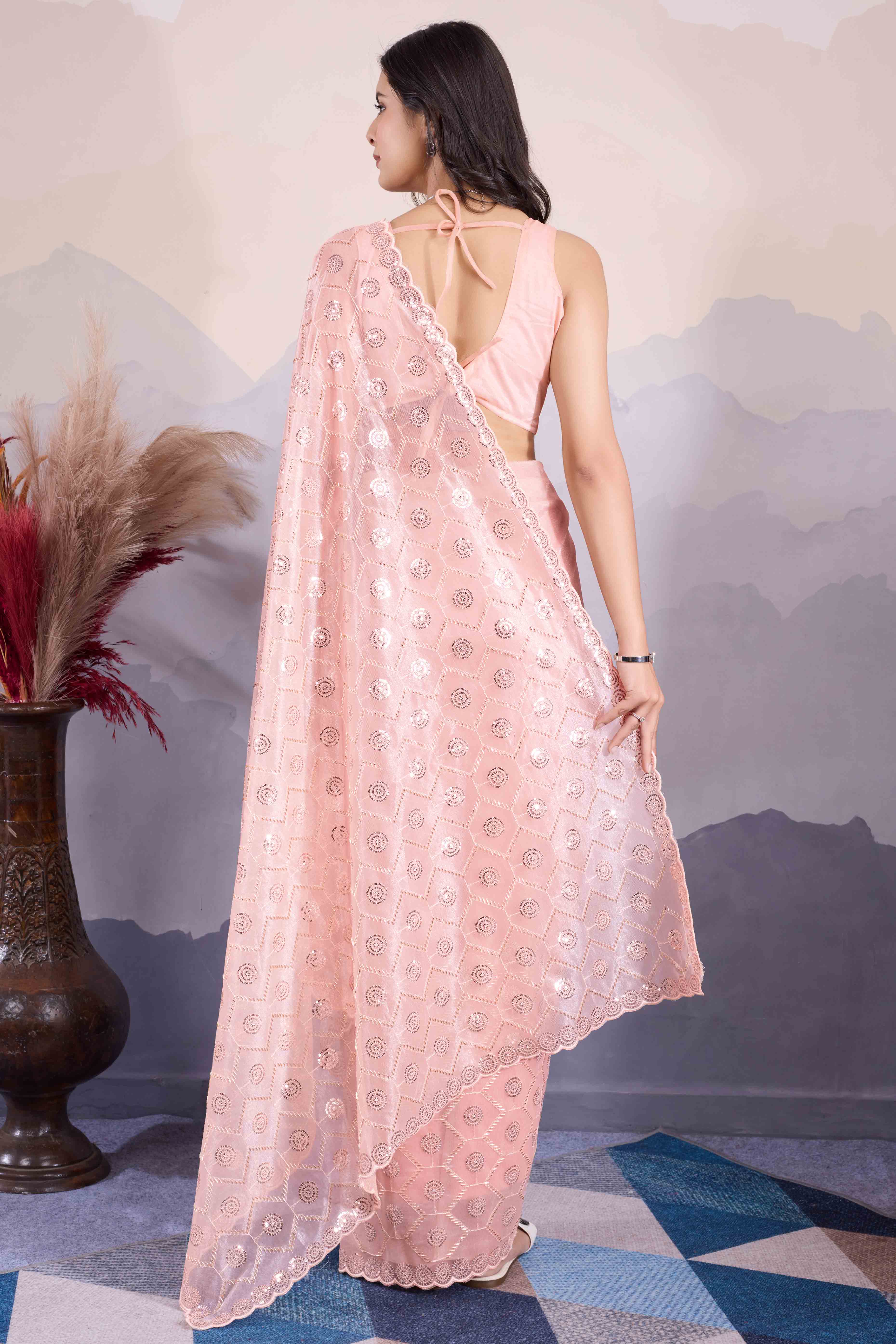 Peach Sequins Embroidered Twill Net Saree