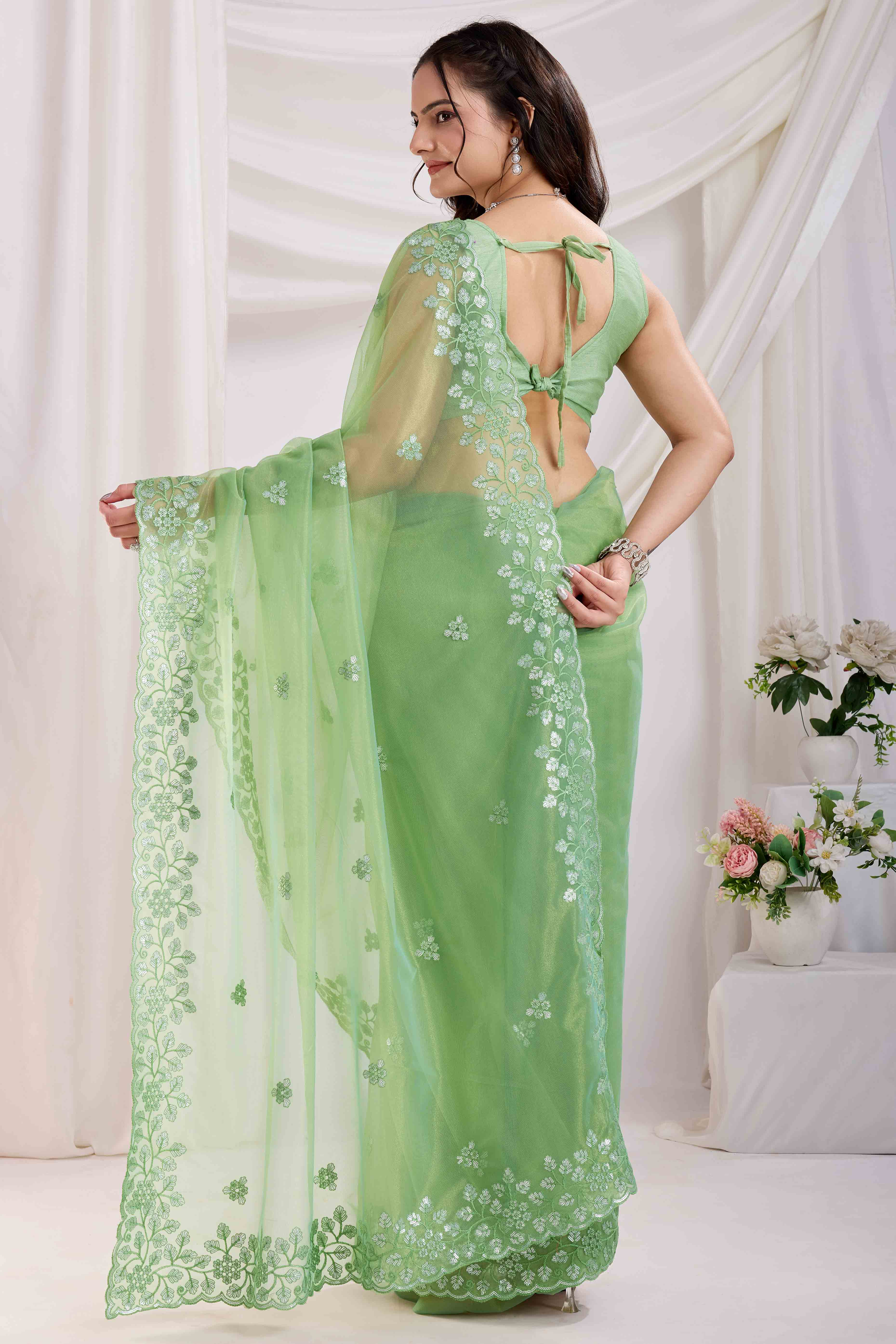 Green Twill Net Saree Embellished With Sequin Floral Embroidery