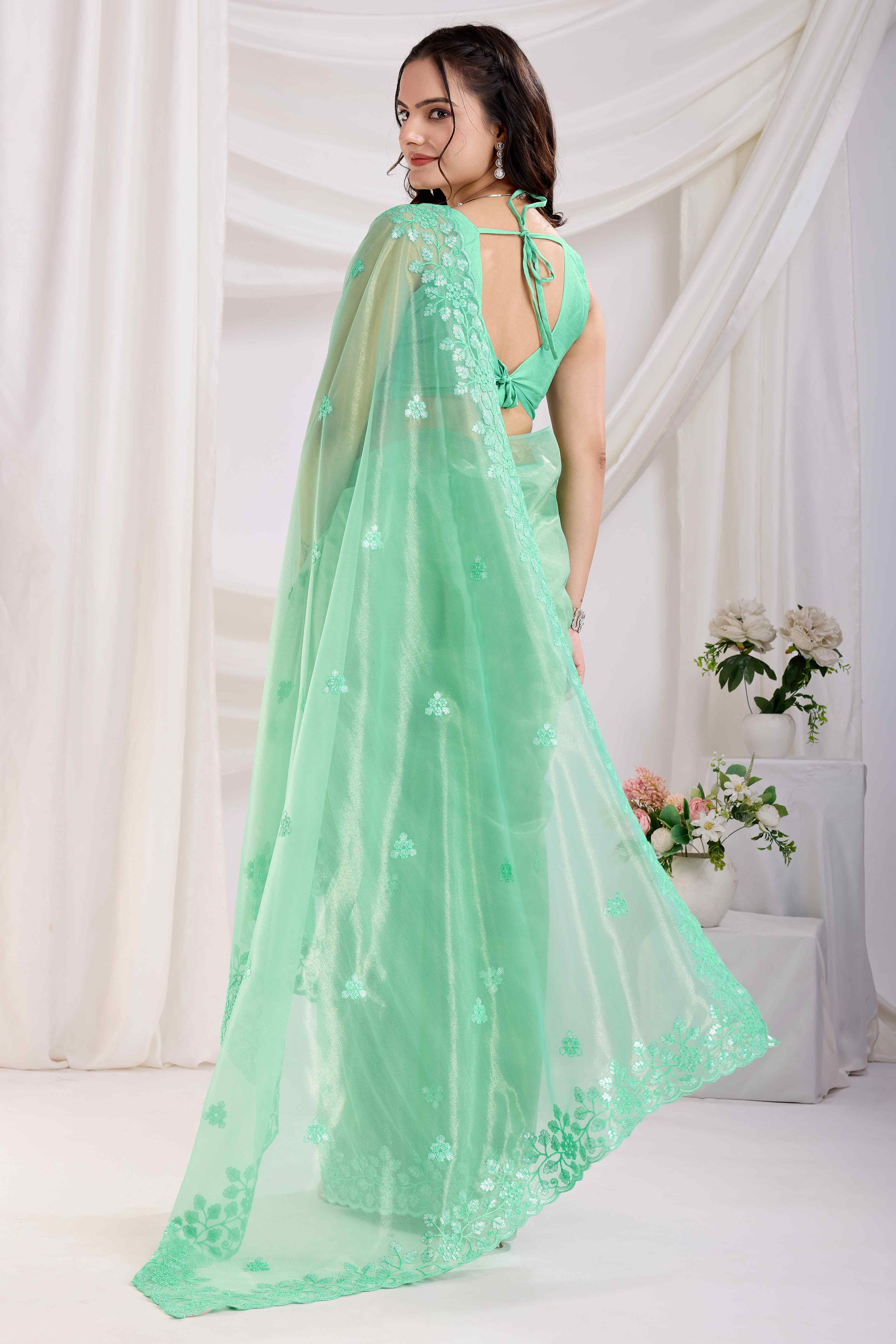Sea Green Floral Sequins Embroidered Twill Net Saree