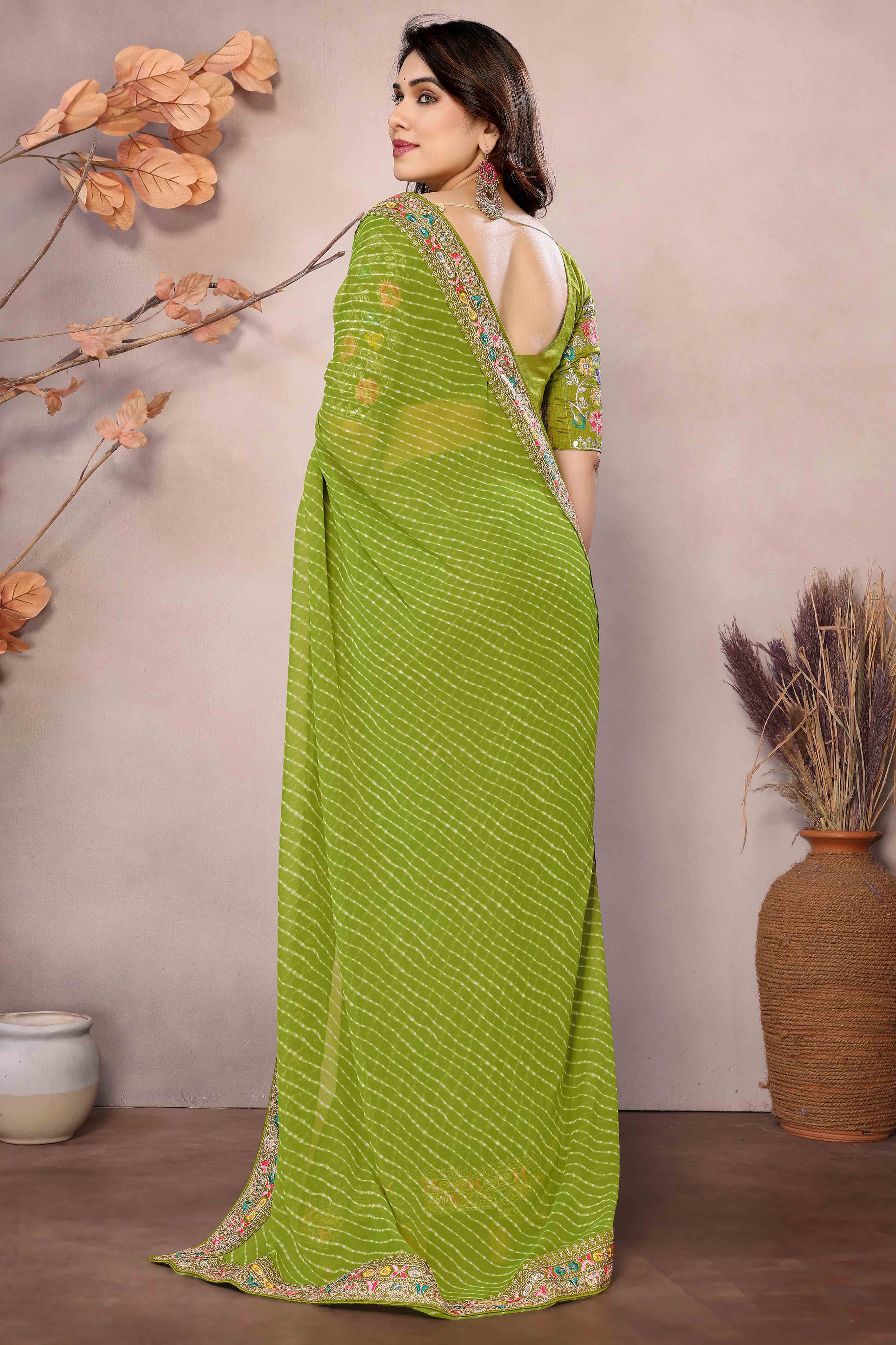 Green Striped Printed Georgette Saree With Glittering Sequin Cording Embroidered Border
