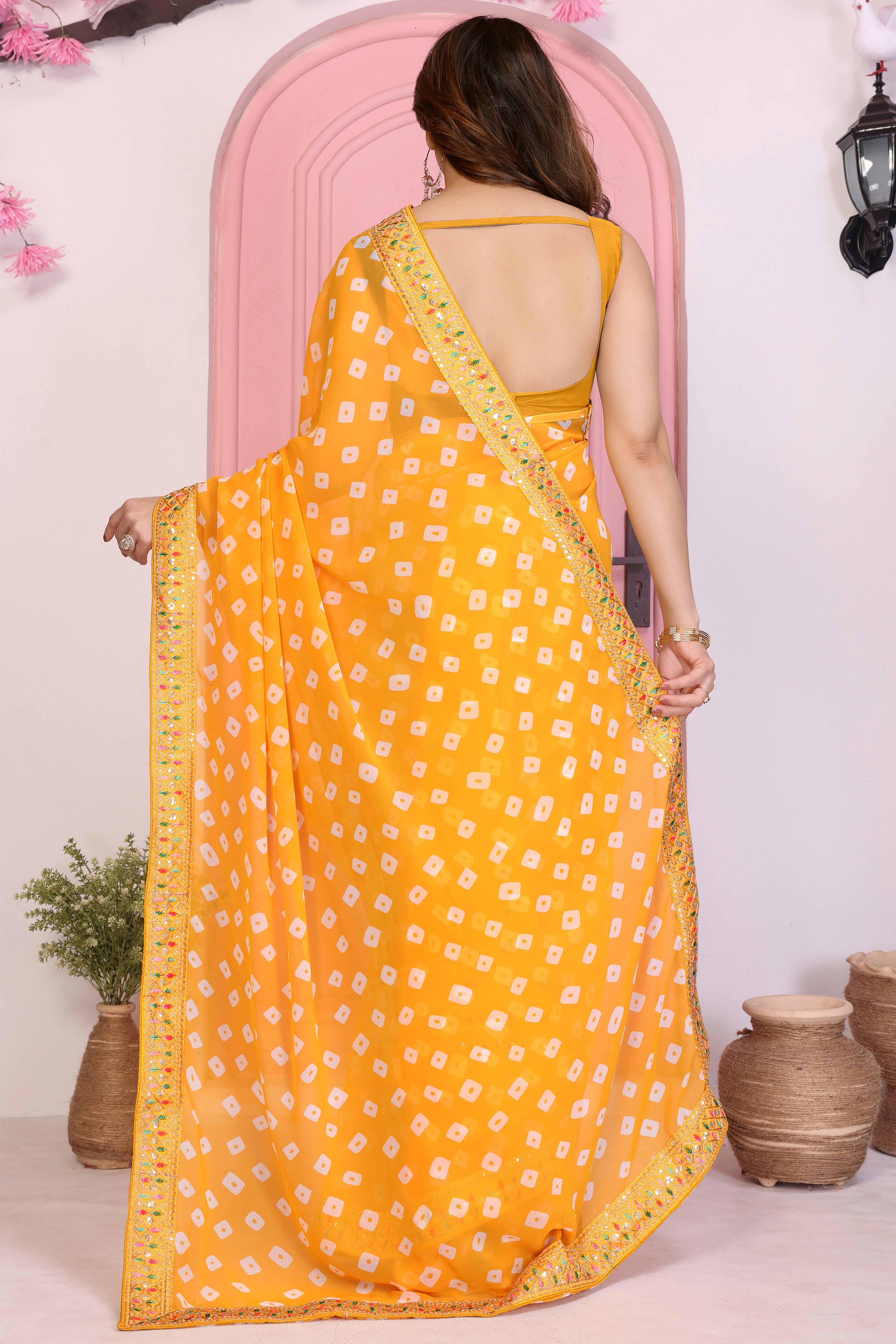 Yellow Georgette Saree With Bandhani Print & Exquisite Cording Embroidery Border