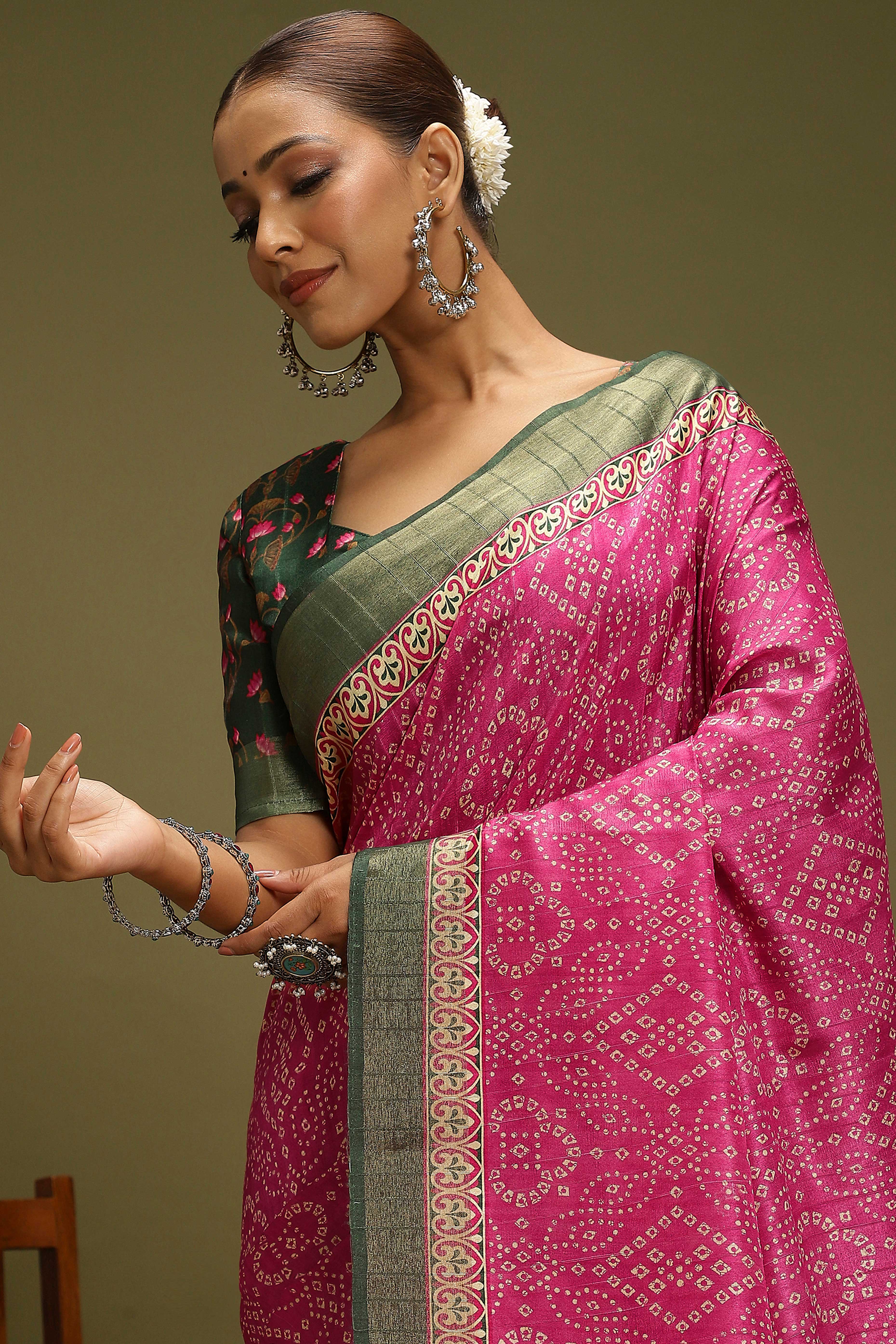 Pink Silk Blend Saree Decorated with Vibrant Bandhani Prints and Festive Detailing