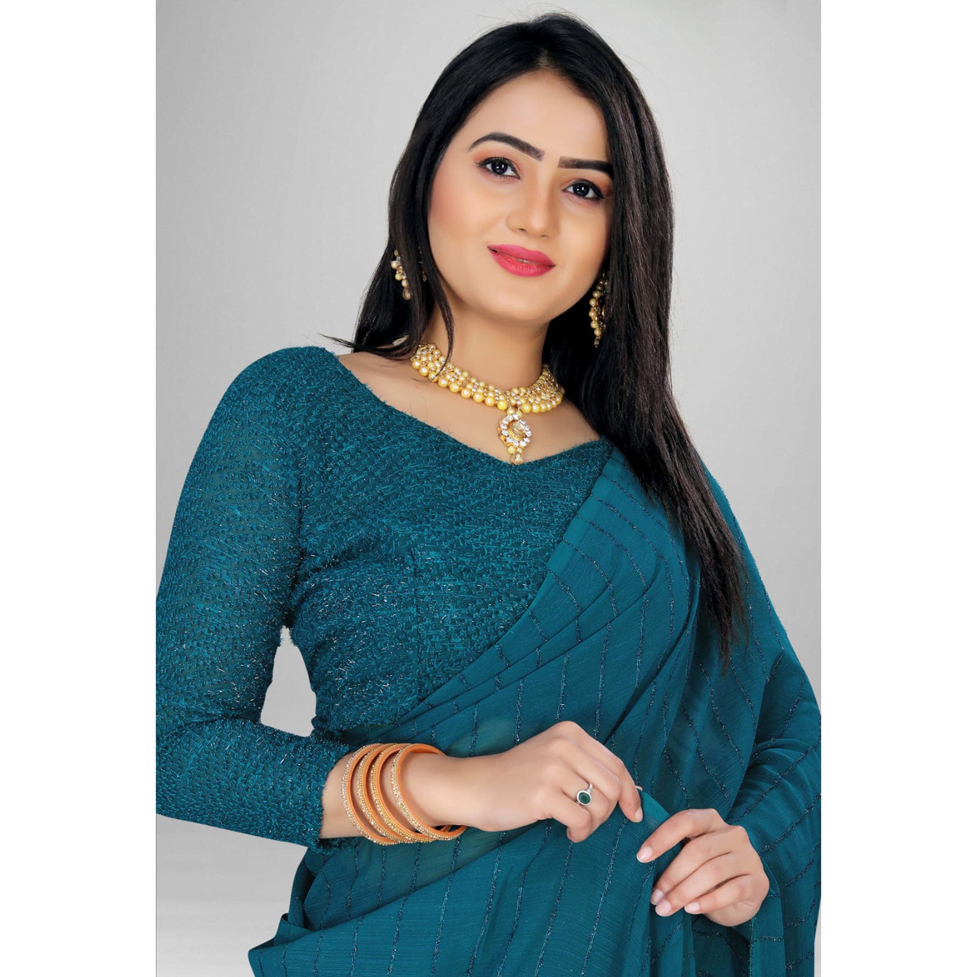 Teal Woven Chiffon Saree with Tassels