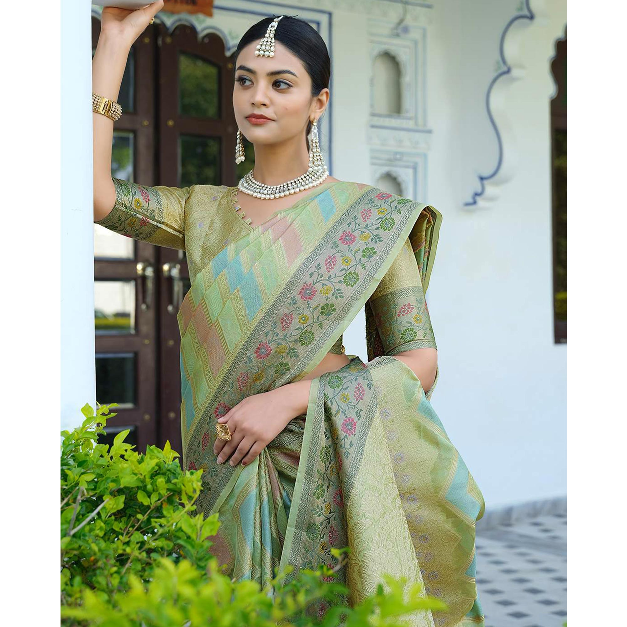 Green Woven Organza Saree With Tassels