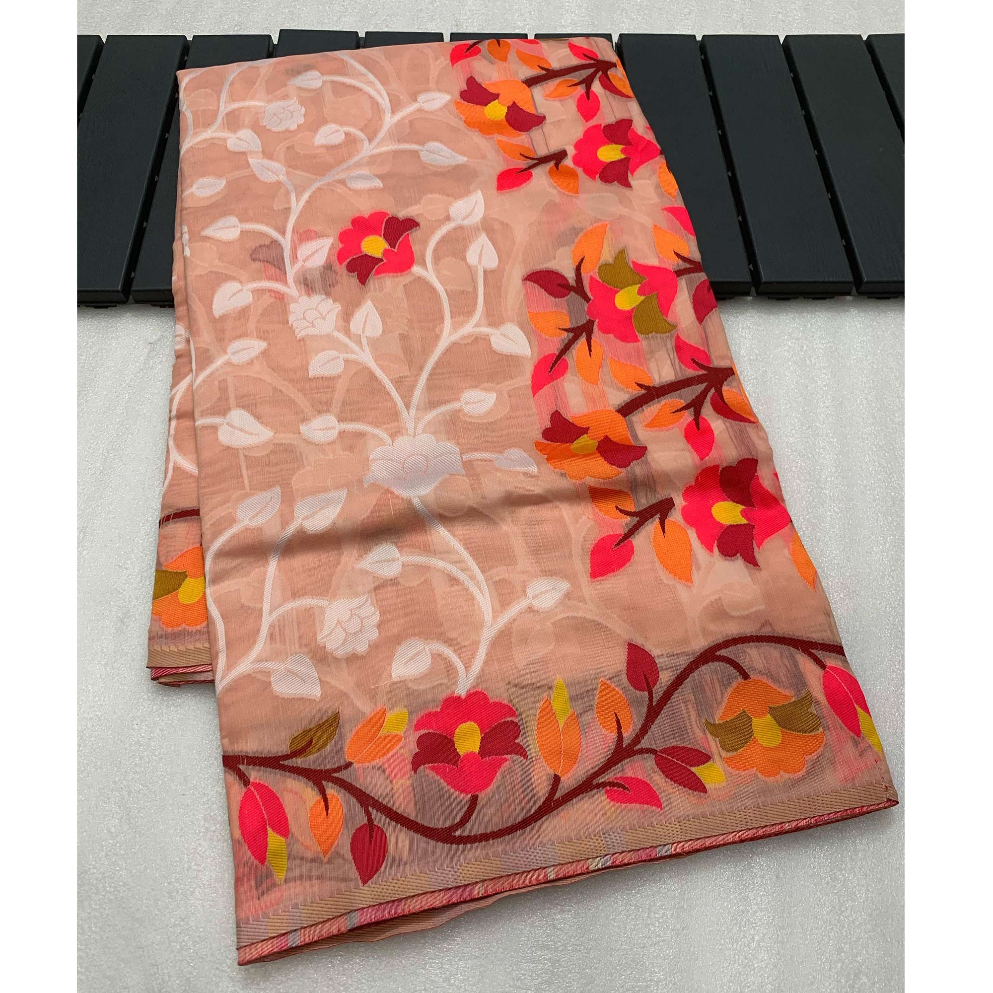 Peach Floral Woven Cotton Jacquard Jamdani Saree With A Graceful Tassel Border