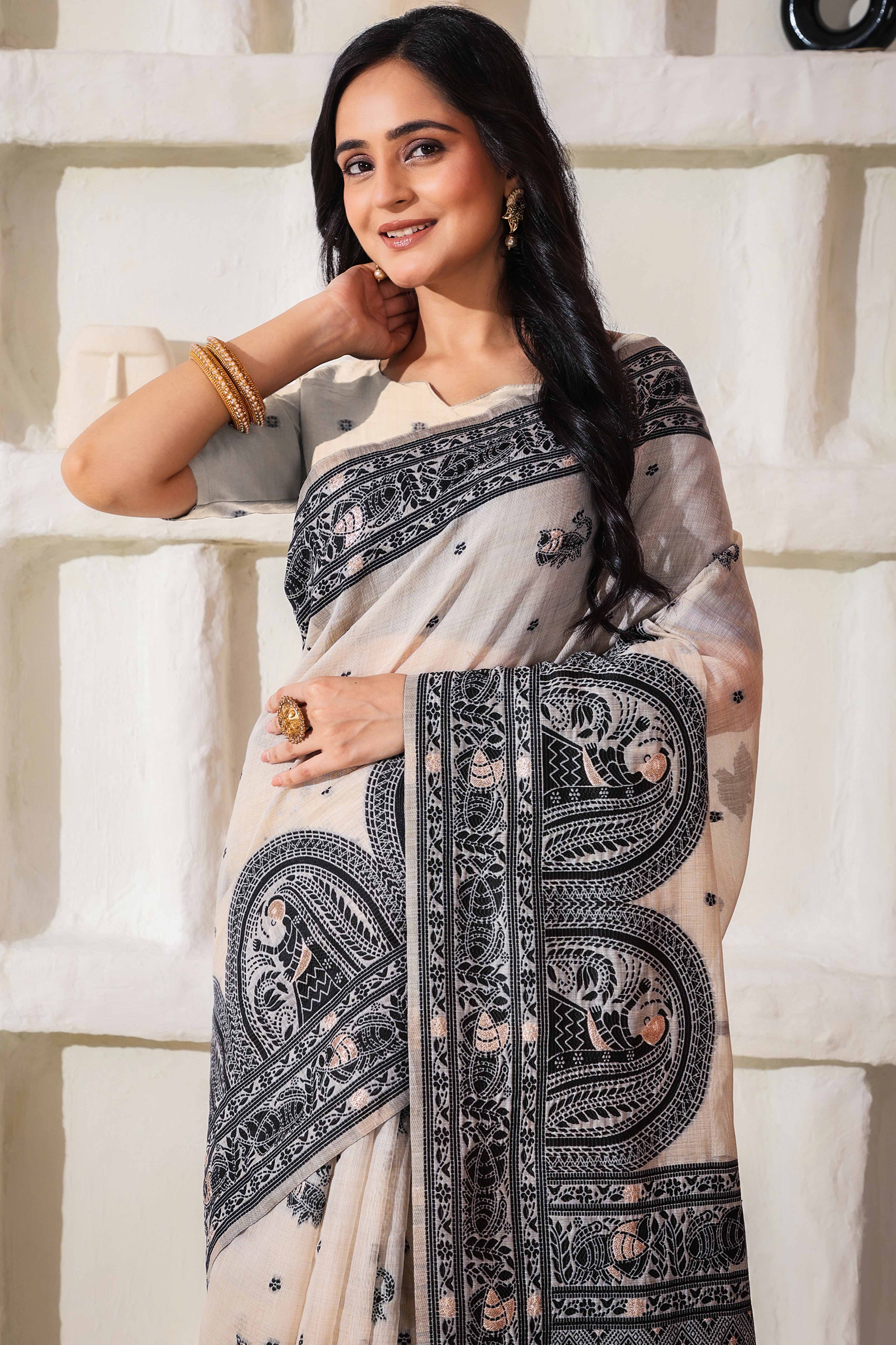 Weaving Cream & Black Linen Cotton Saree Adorned With Graceful Tassel Detailing
