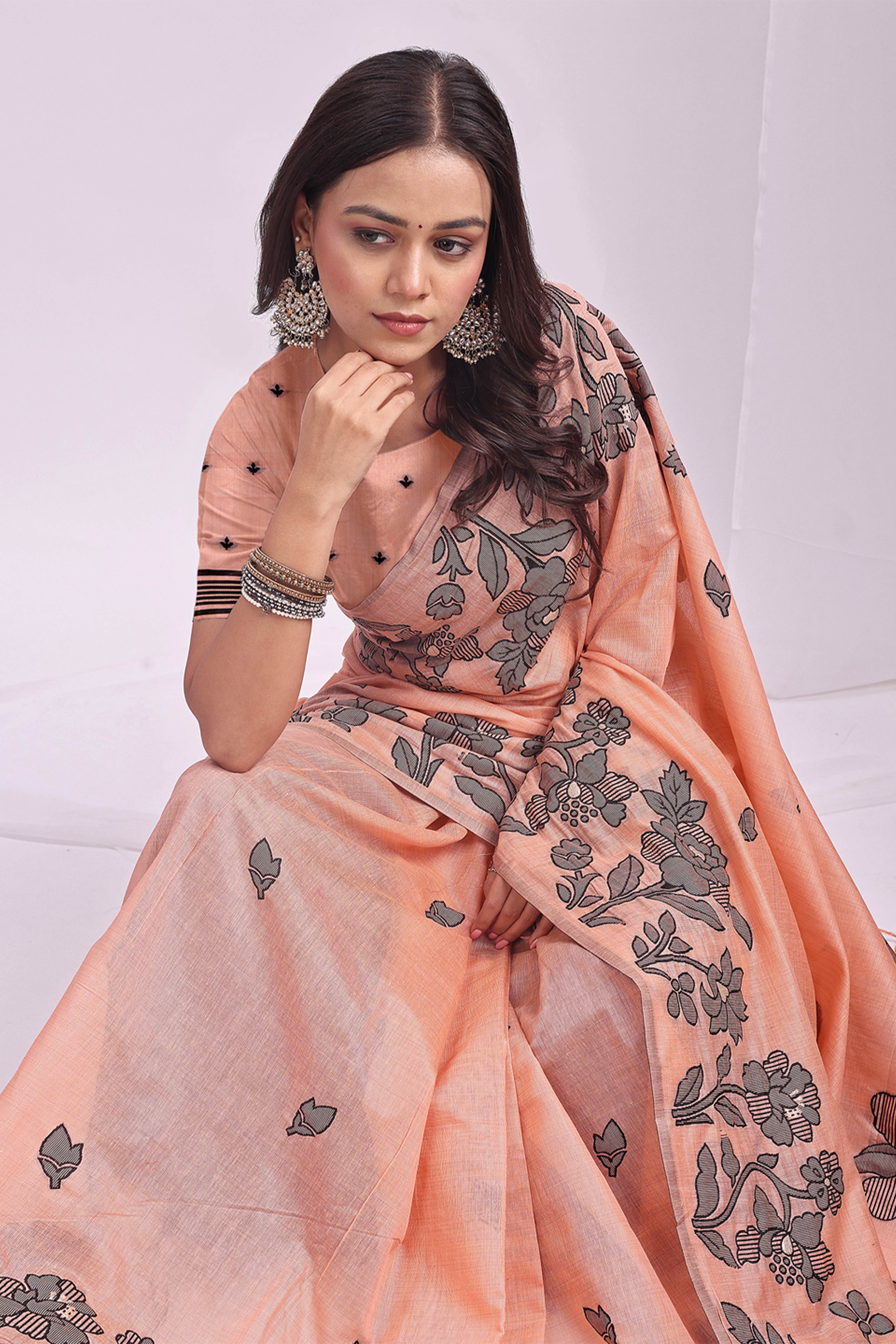 Orange Ethnic Saree in a Linen Cotton Blend Adorned with Floral Weave Designs