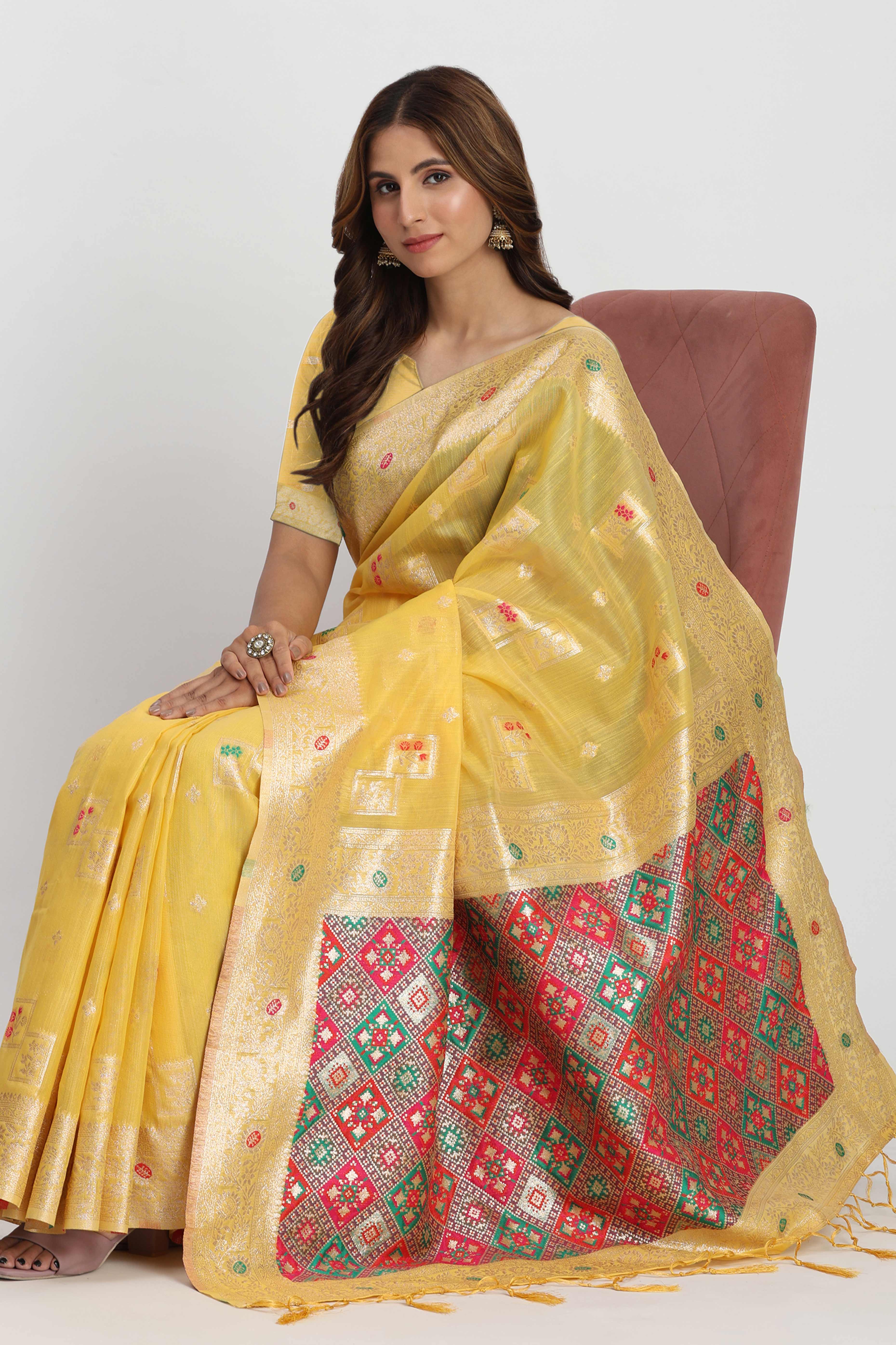 Floral Zari Weaving Brings Regal Beauty To This Yellow Linen Cotton Saree With Tassel Accents