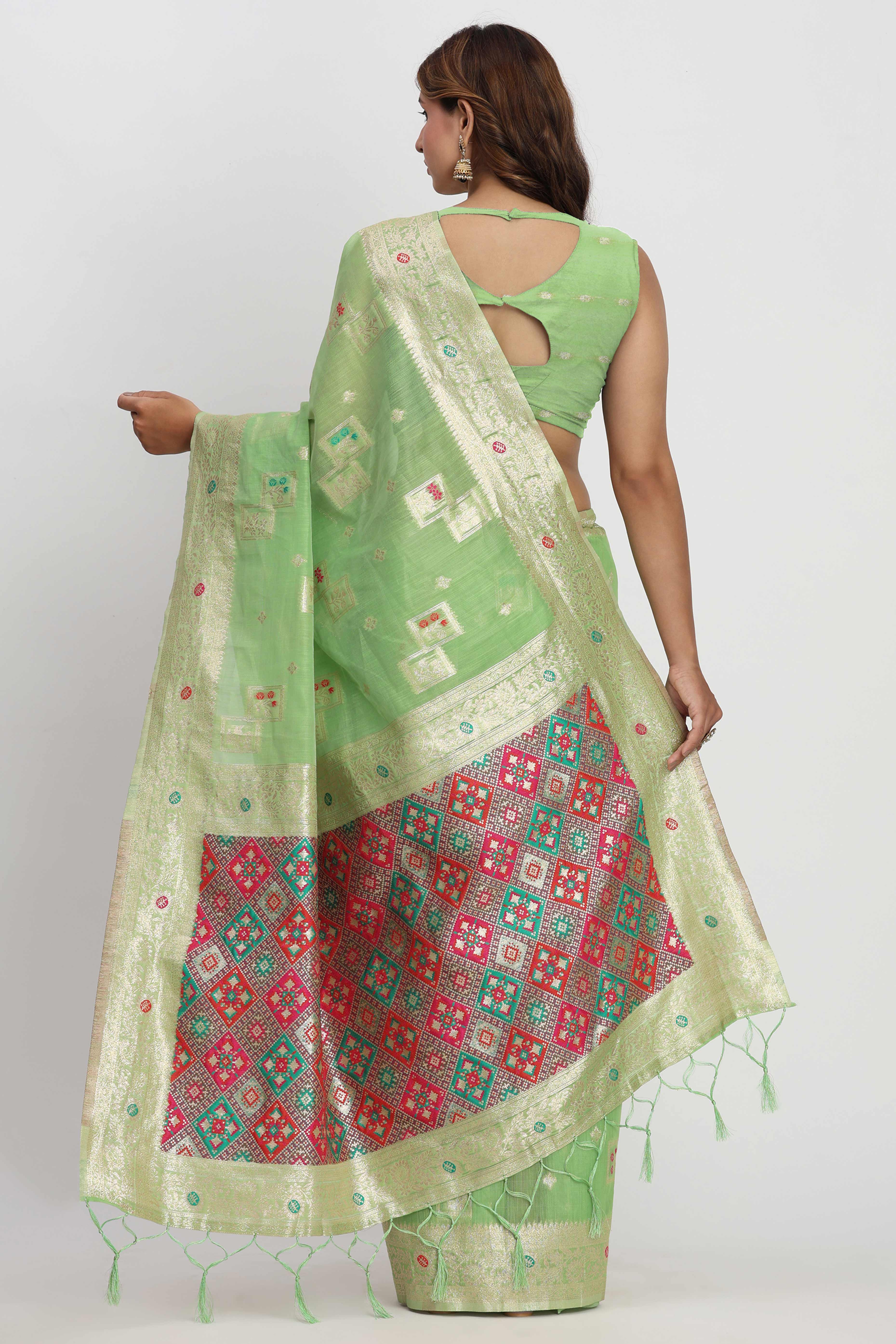 Floral Zari Weaving Brings Regal Beauty To This Light Green Linen Cotton Saree With Tassel Accents