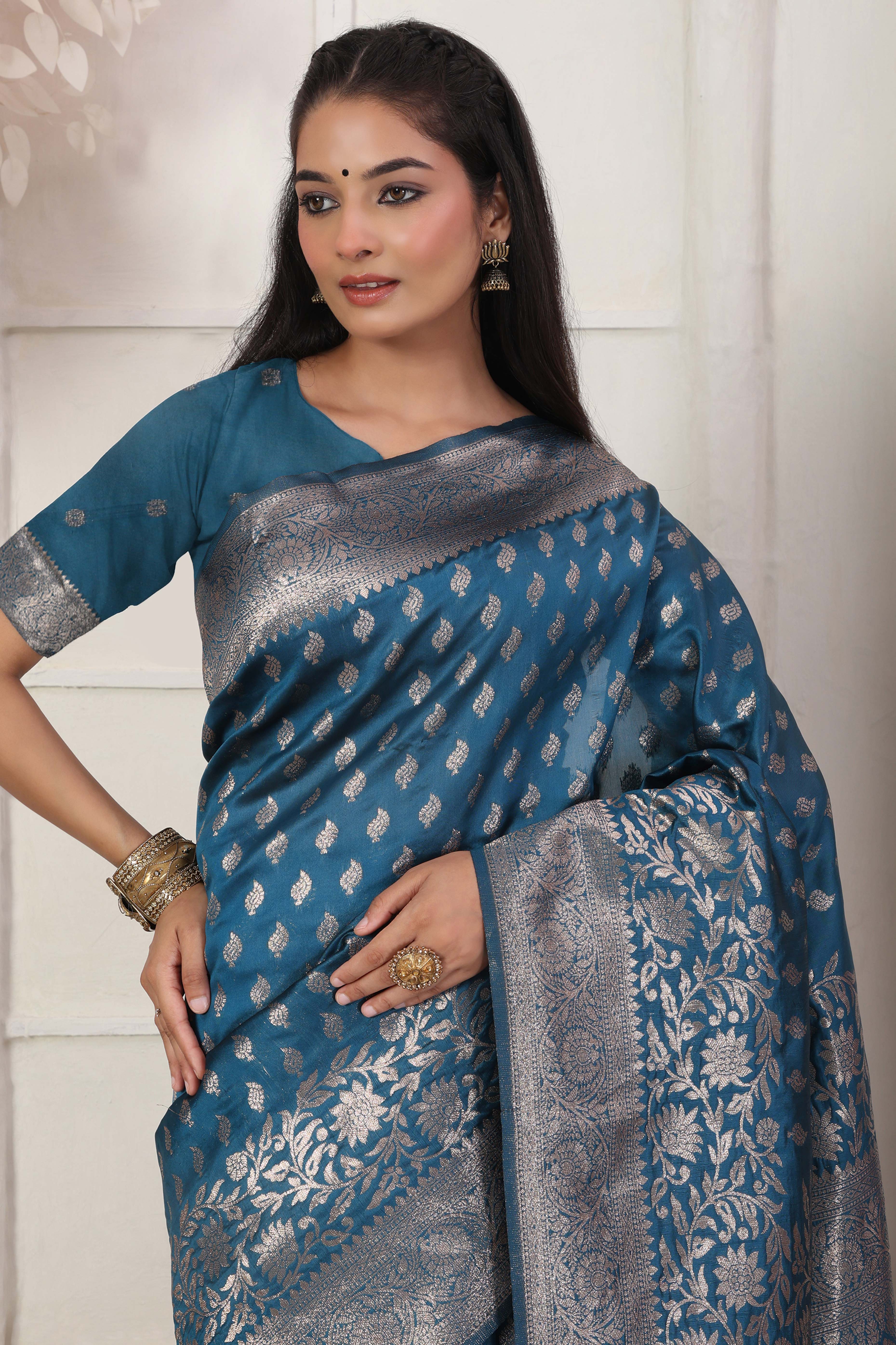 Blue Traditional Lichi Silk Blend Saree Enhanced With Floral Zari Weaving & Tassel Pallu