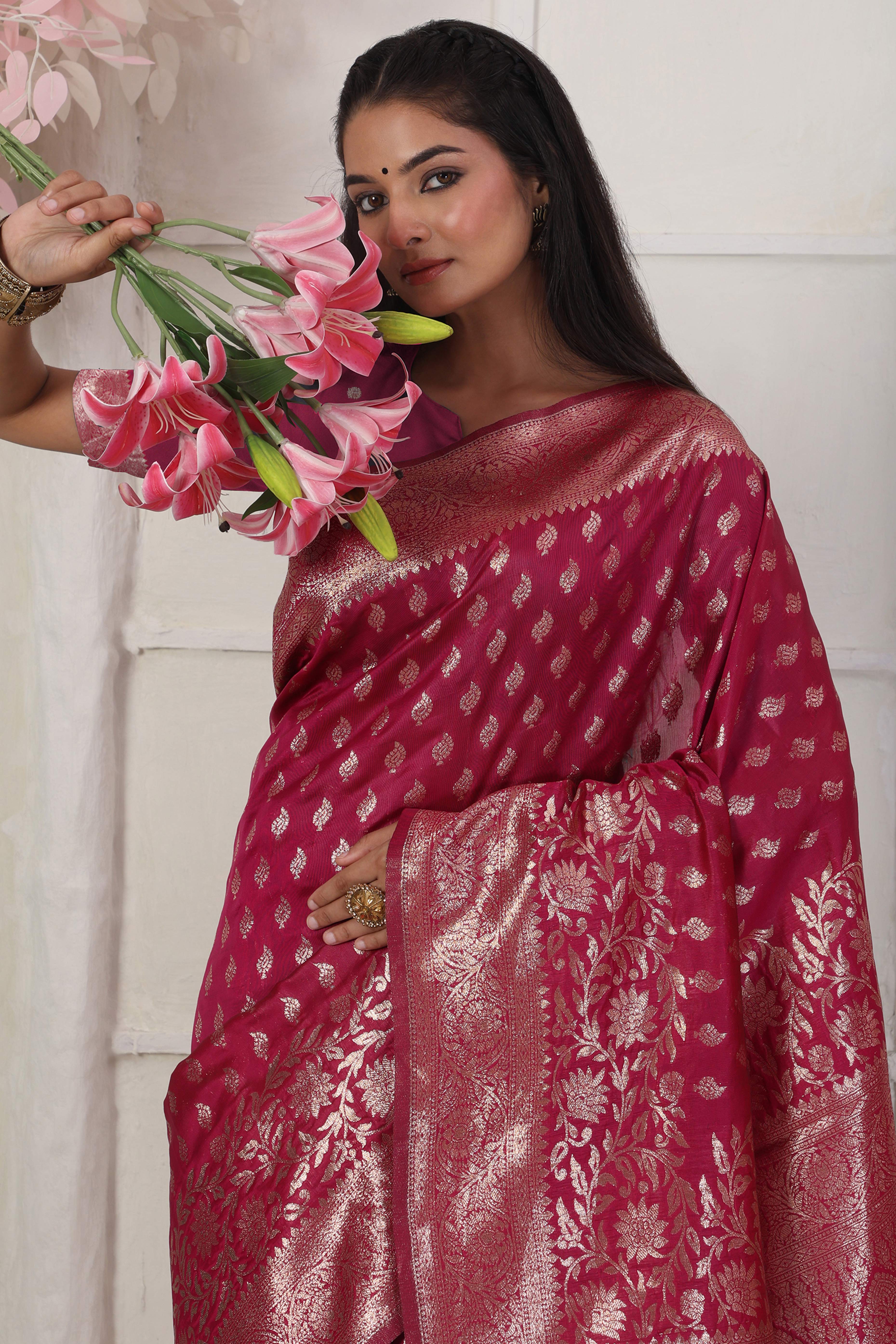 Pink Traditional Lichi Silk Blend Saree Enhanced With Floral Zari Weaving & Tassel Pallu