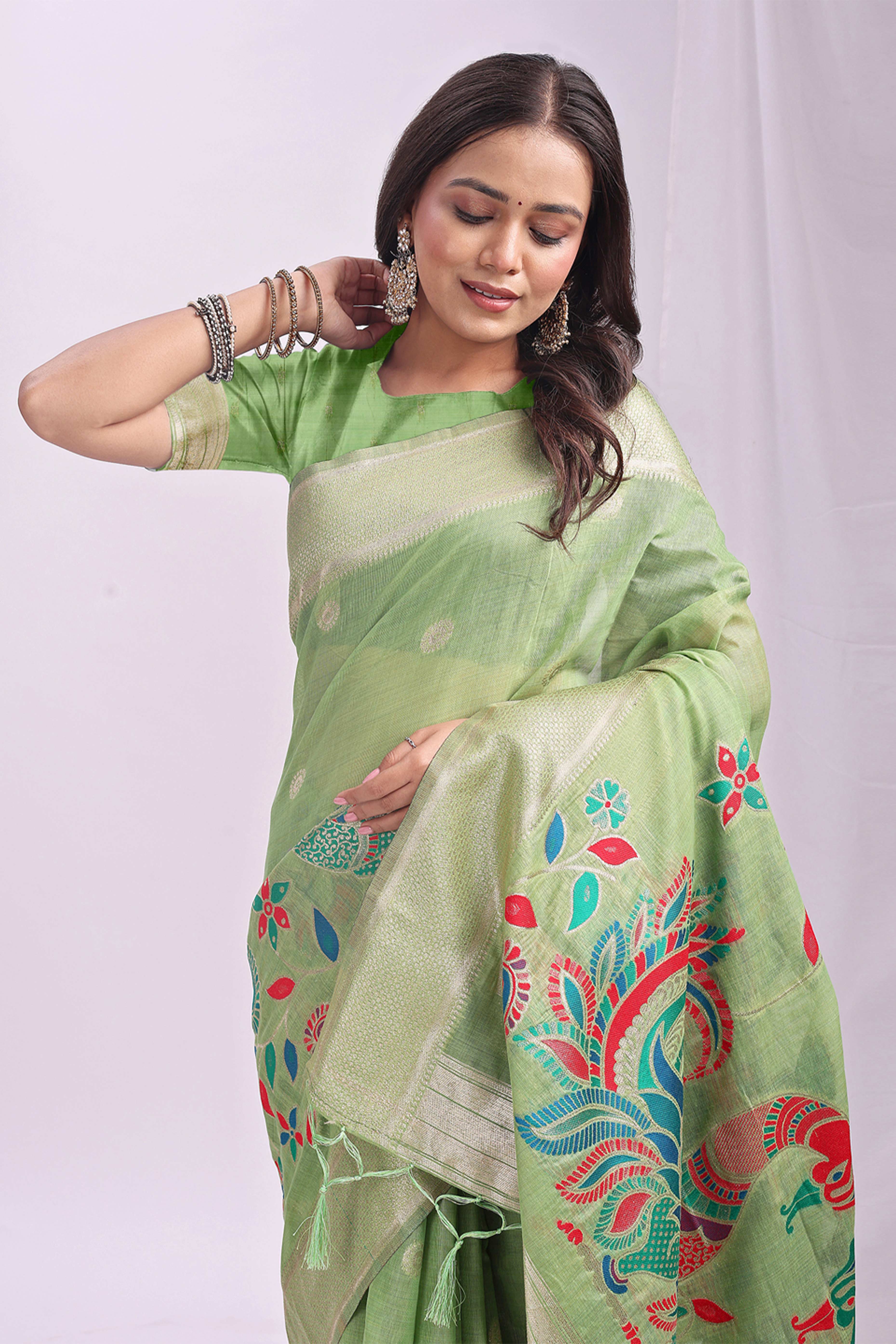 Light Green Floral Woven Linen Cotton Saree Accented With Peacock Motif Pallu & Zari Border