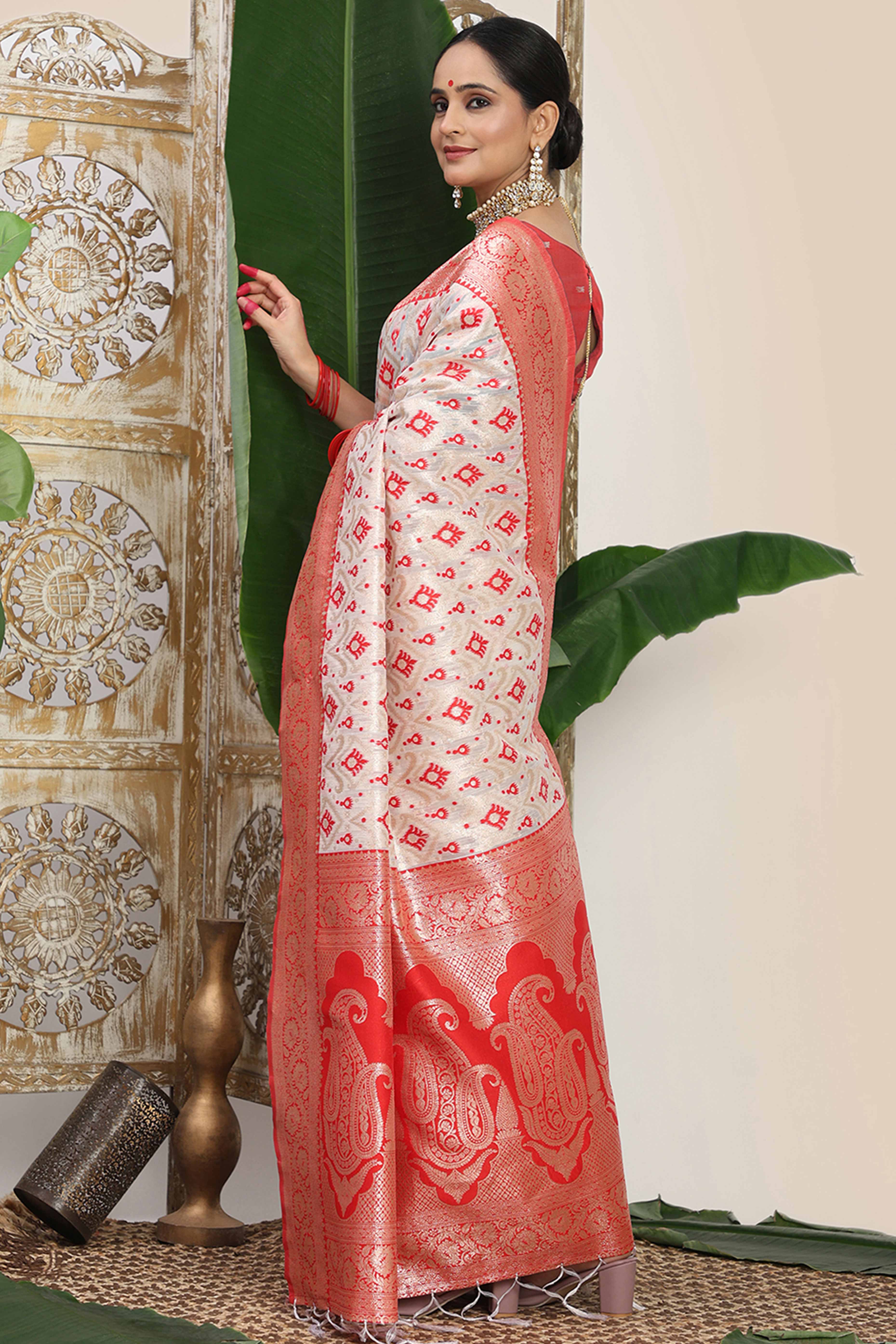 White & Red  Linen Cotton Saree Accented With Rich Zari Weaving And A Decorative Tassel Pallu