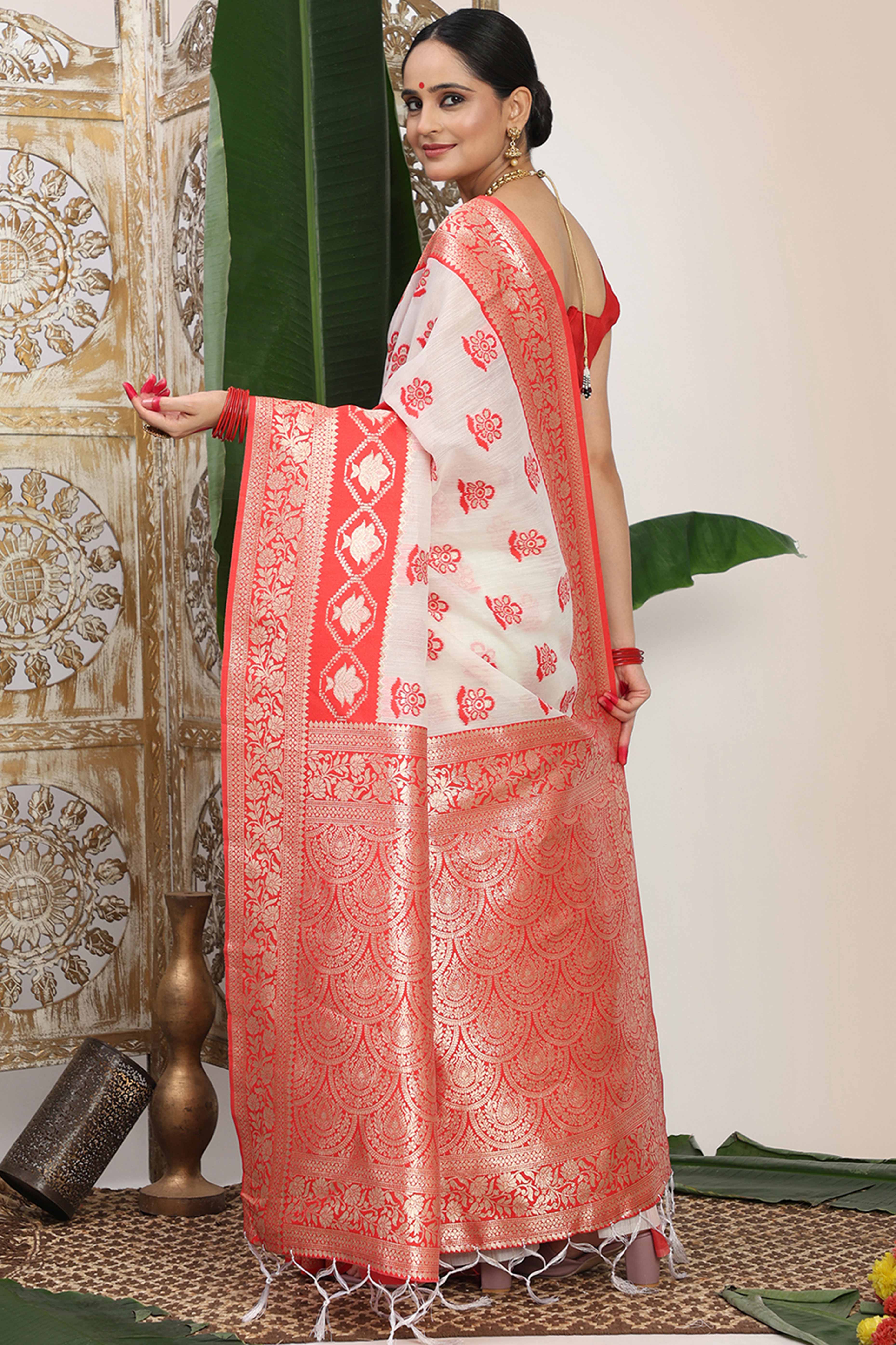 Chic White & Red  Saree In Linen Cotton Flaunting Traditional Zari Weaving And A Tasselled Edge