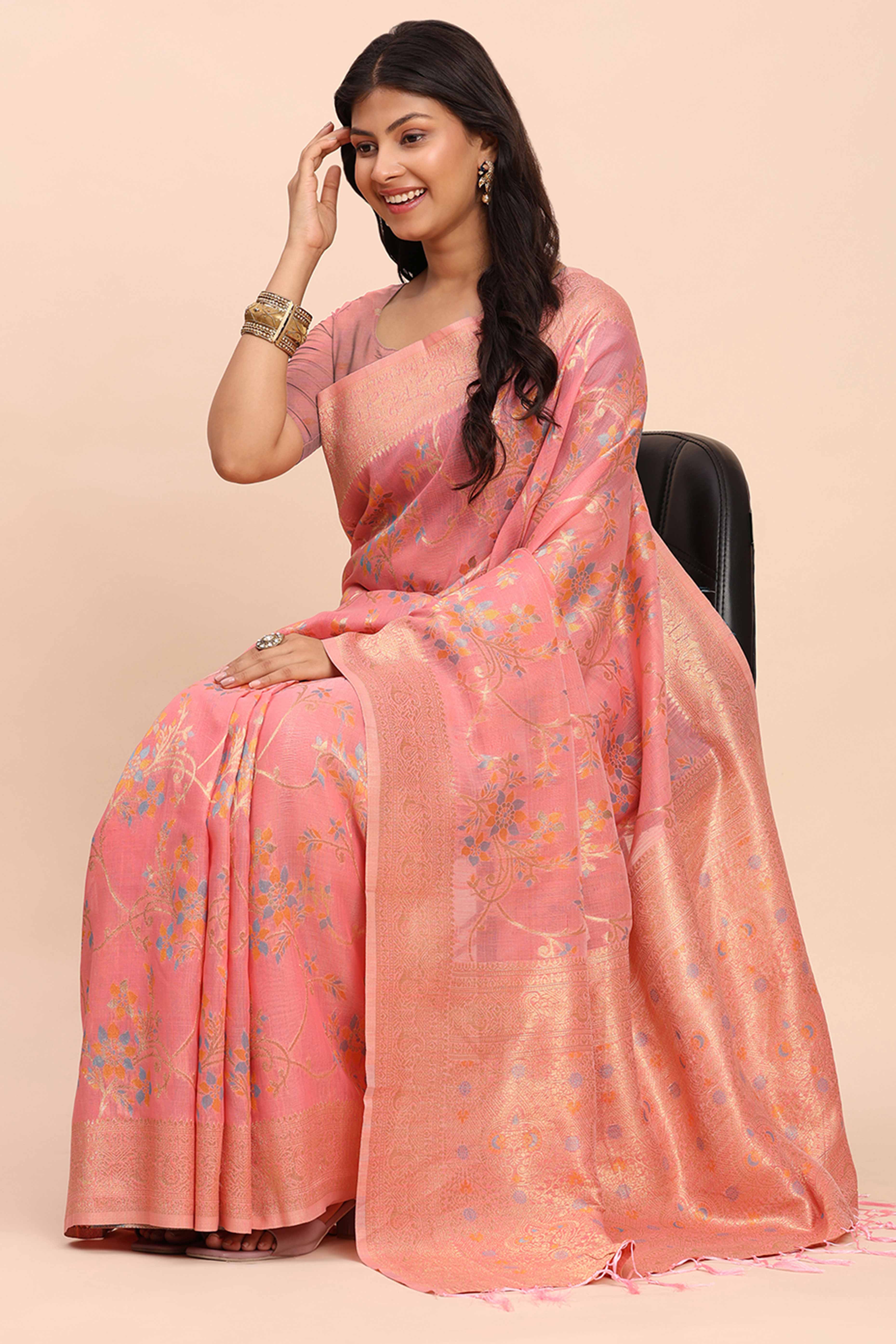 Salmon Pink Linen Cotton Saree Showcasing Floral Zari Weaves & A Tasselled Finish Pallu