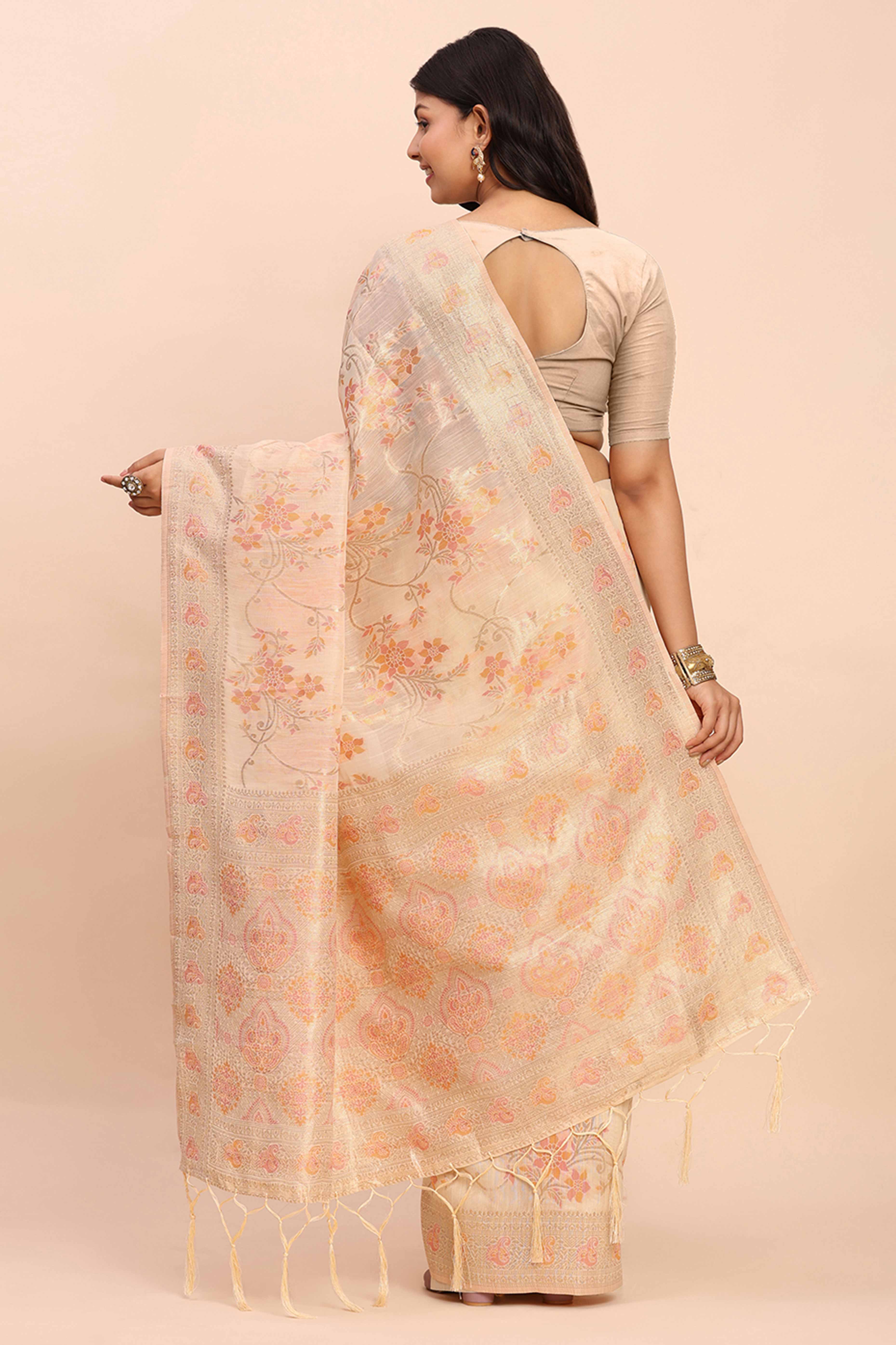 Cream Linen Cotton Saree Showcasing Floral Zari Weaves & A Tasselled Finish Pallu