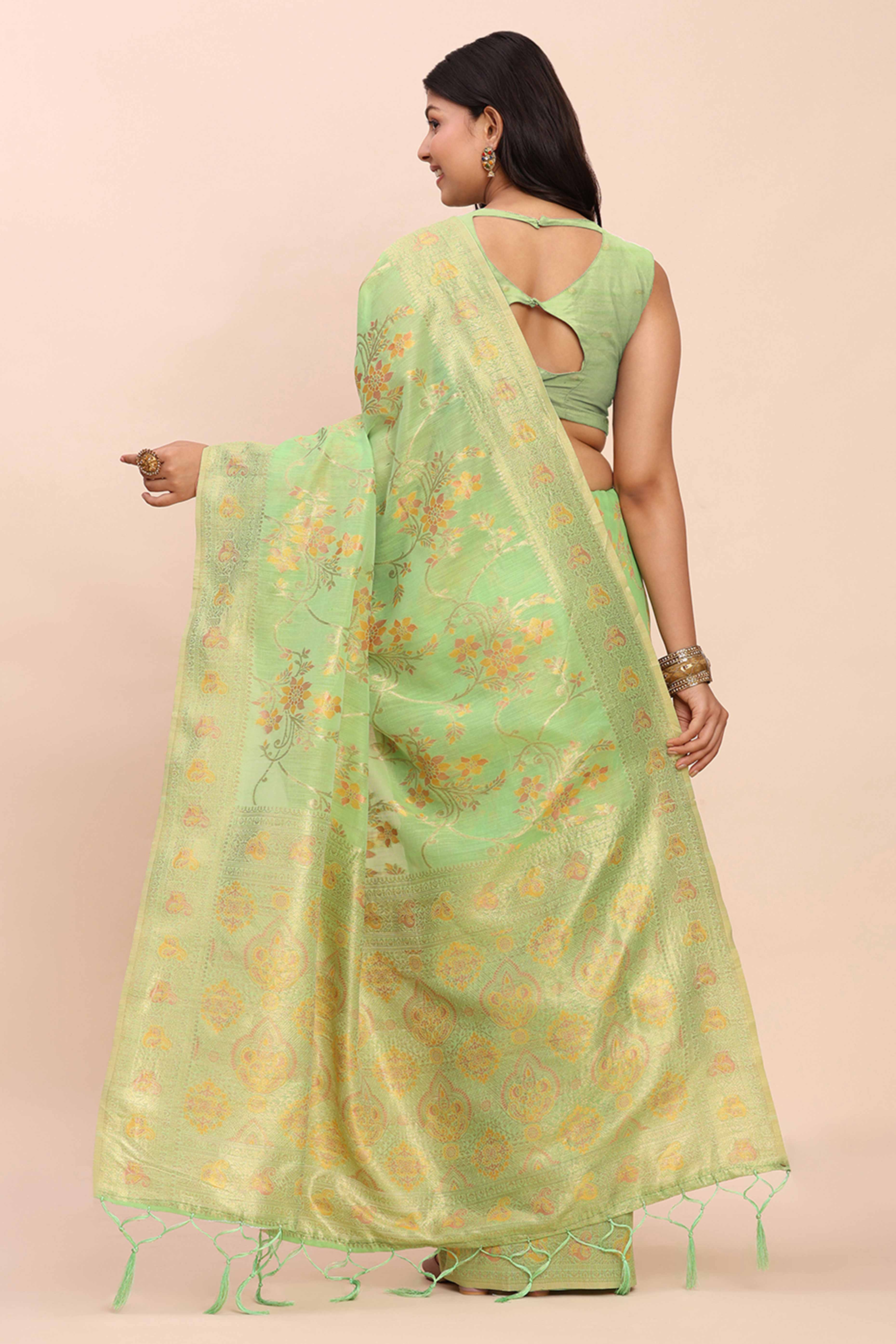 Green Linen Cotton Saree Showcasing Floral Zari Weaves & A Tasselled Finish Pallu