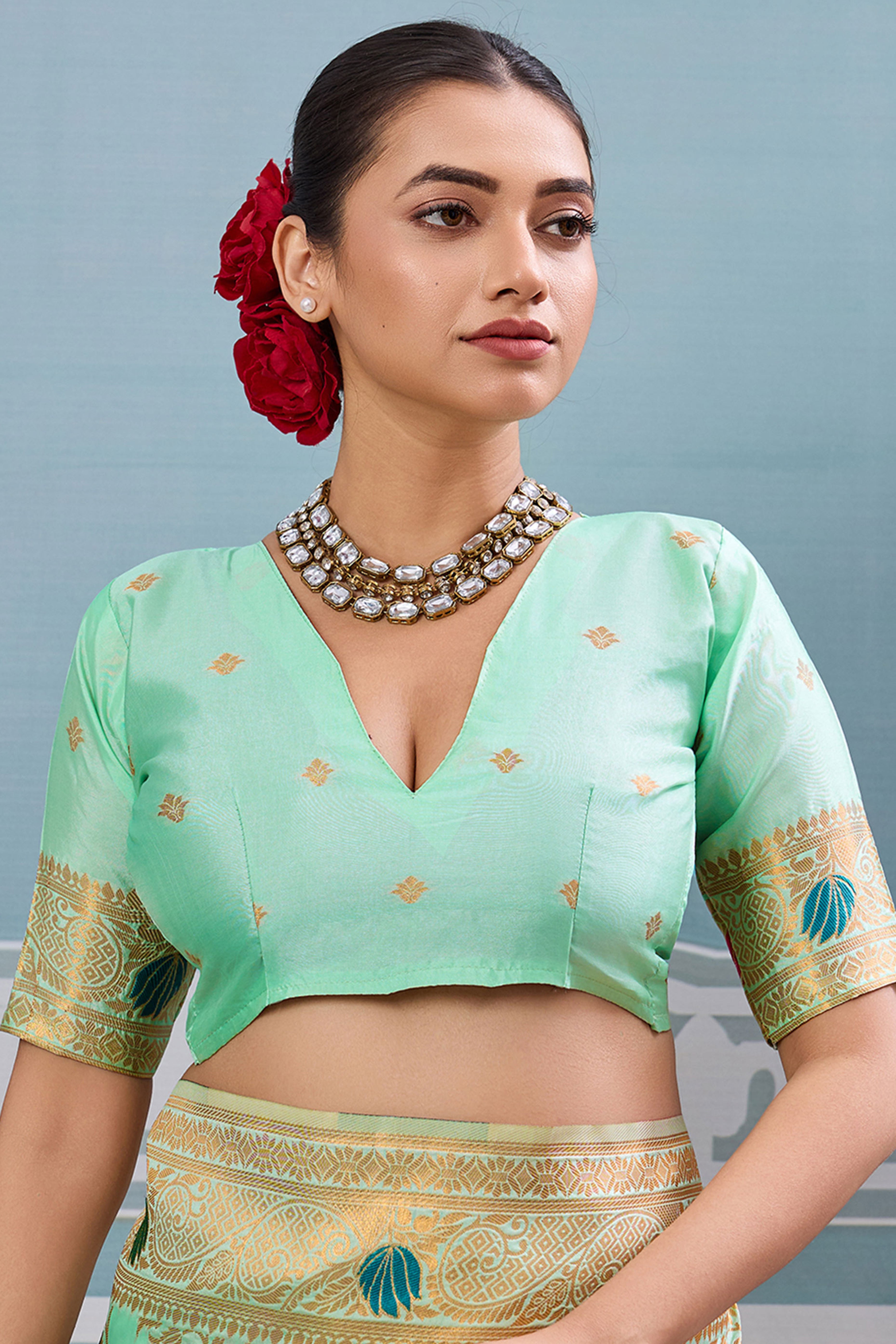 Radiant Sea Green Silk Blend Saree Adorned With Intricate Floral Zari Weaving & Tassel Pallu