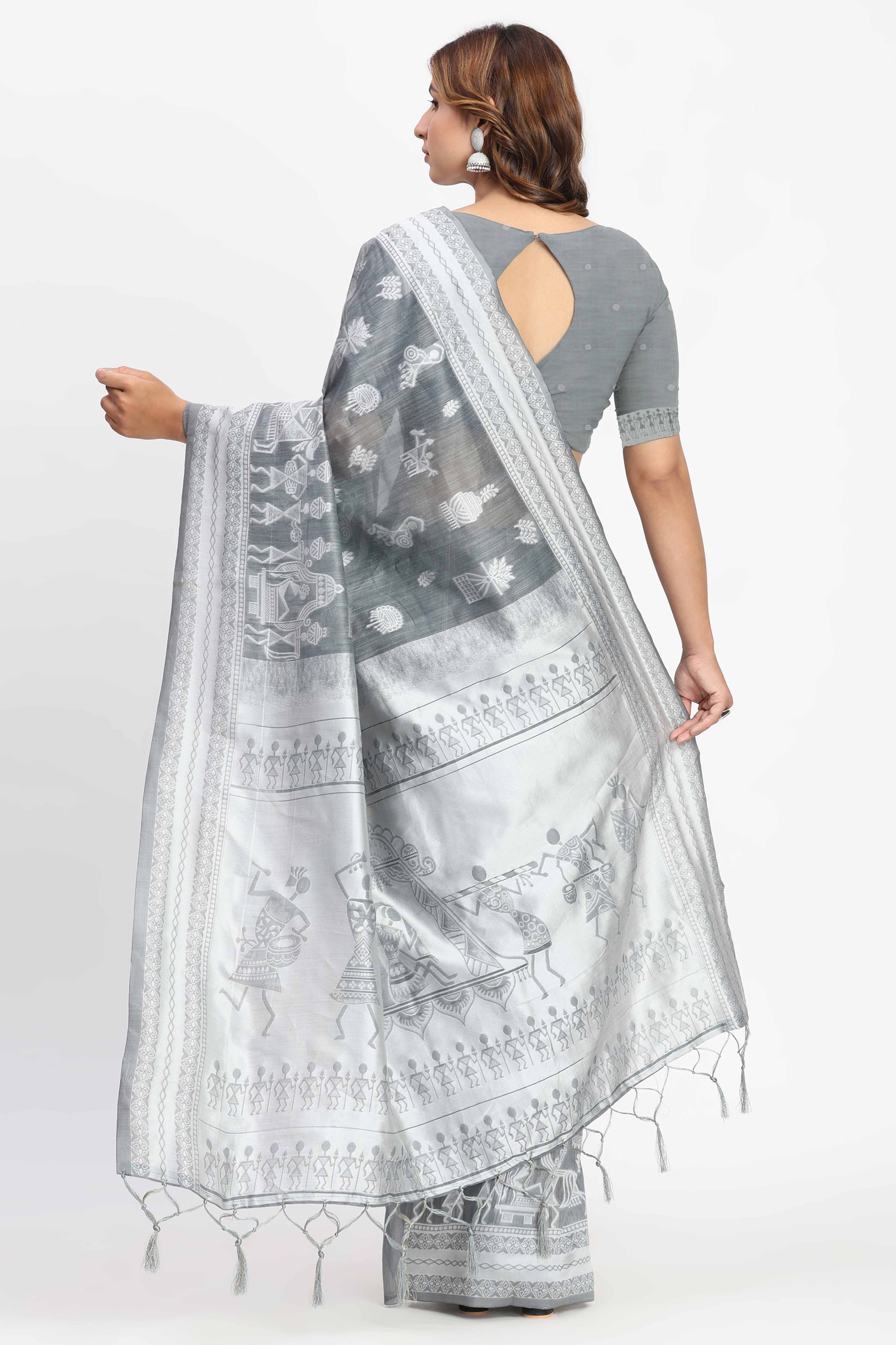 Grey Linen Cotton Saree Showcasing Traditional Warli Motifs In Zari Weaving With Tassel Pallu