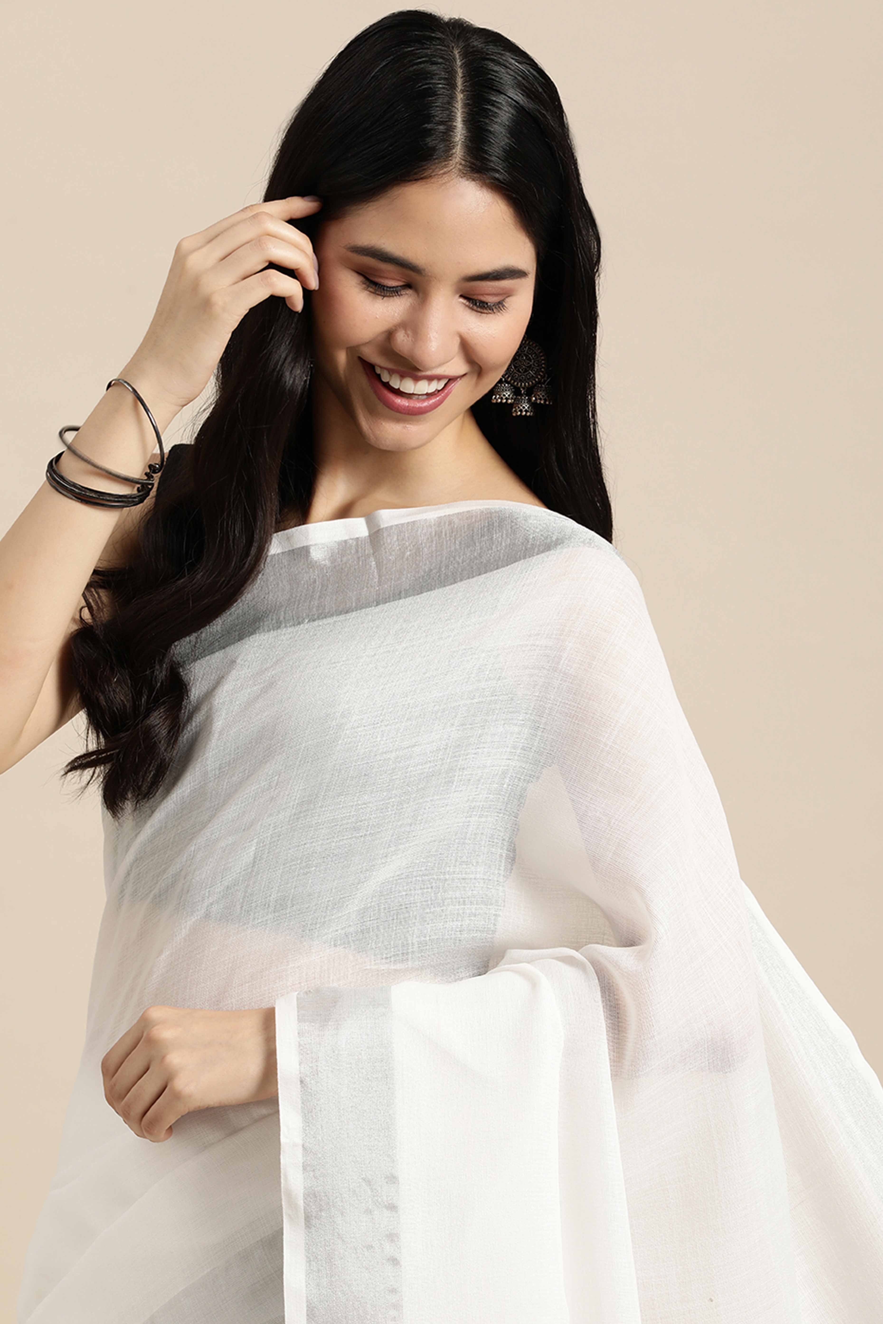 White Linen Saree Adorned With Silver Zari Weaving Border & Pallu