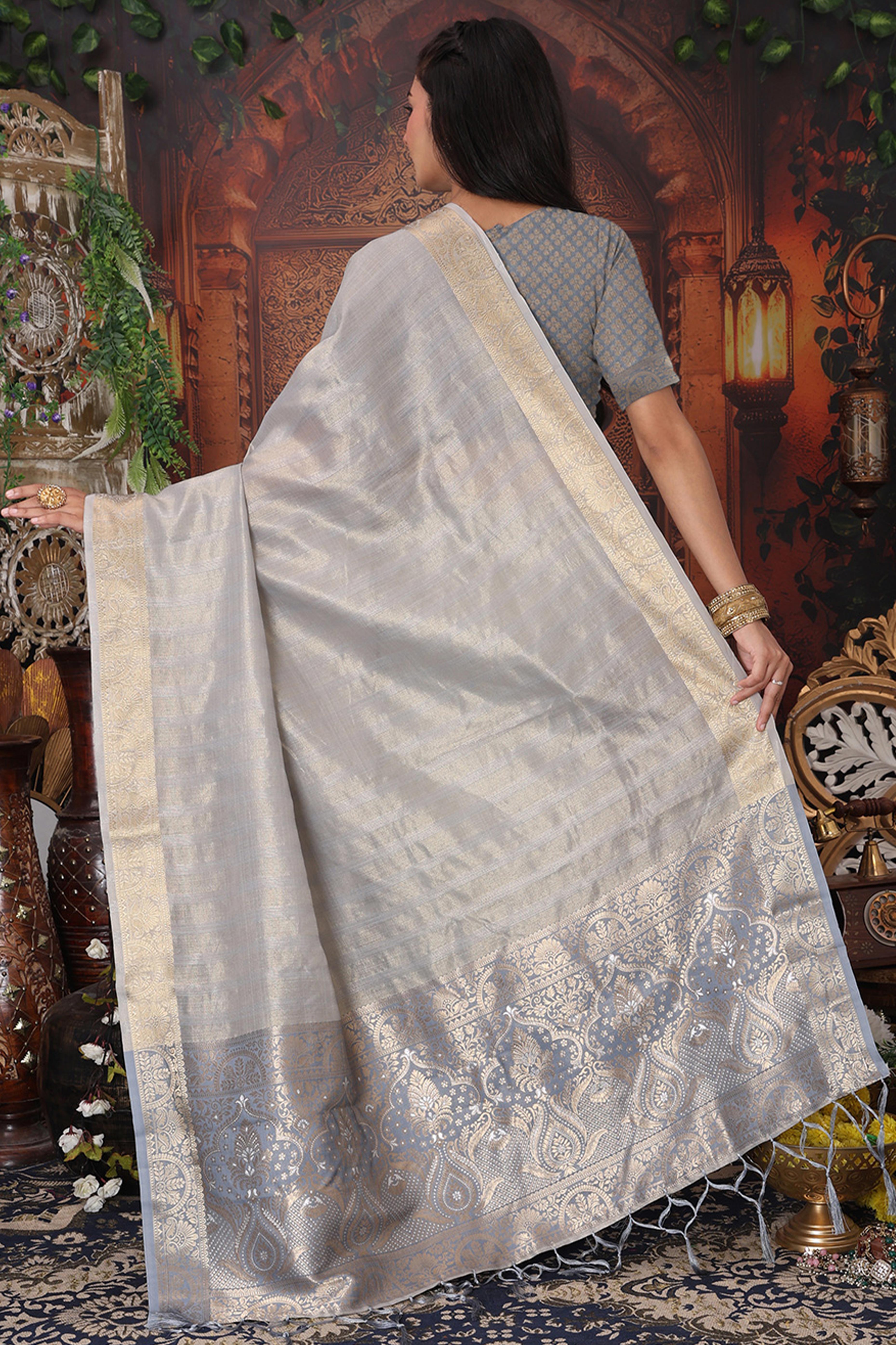 Grey Organza Saree Adorned With Floral Zari Weaving & Graceful Tassel Pallu