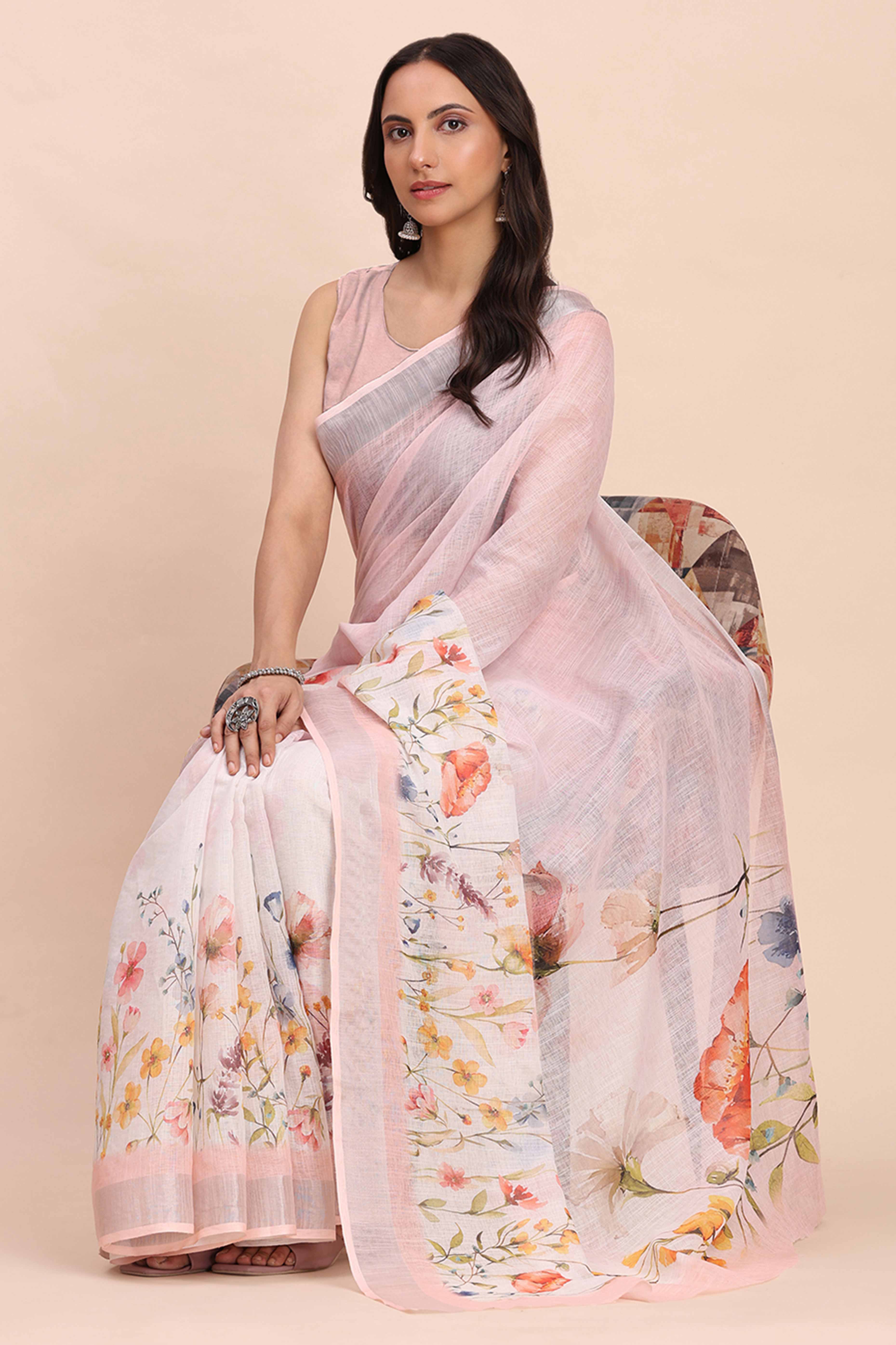 Light Pink Linen Cotton Saree Featuring Floral Prints & Woven Border