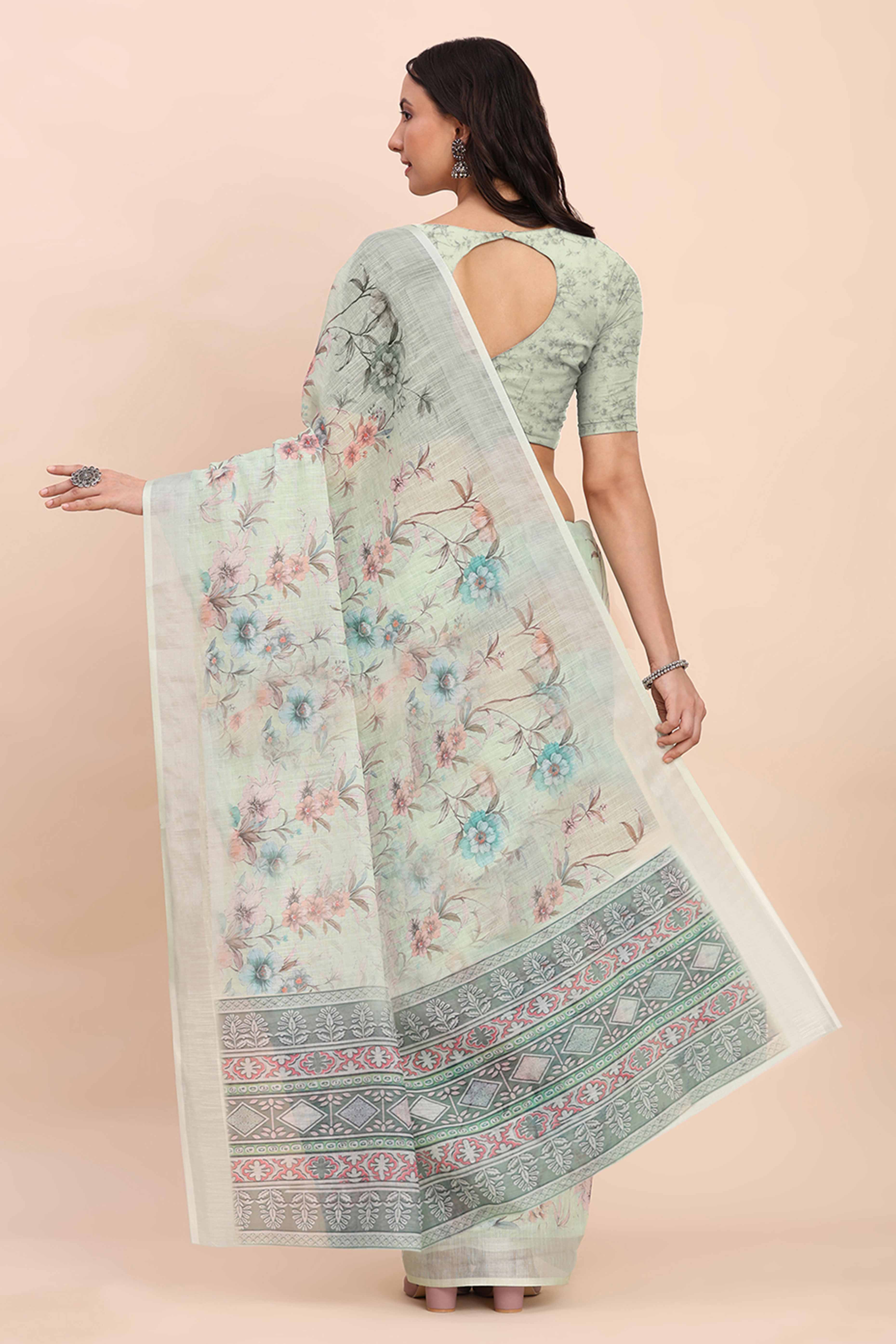 Light Green Linen Cotton Saree Featuring Floral Prints & Woven Border