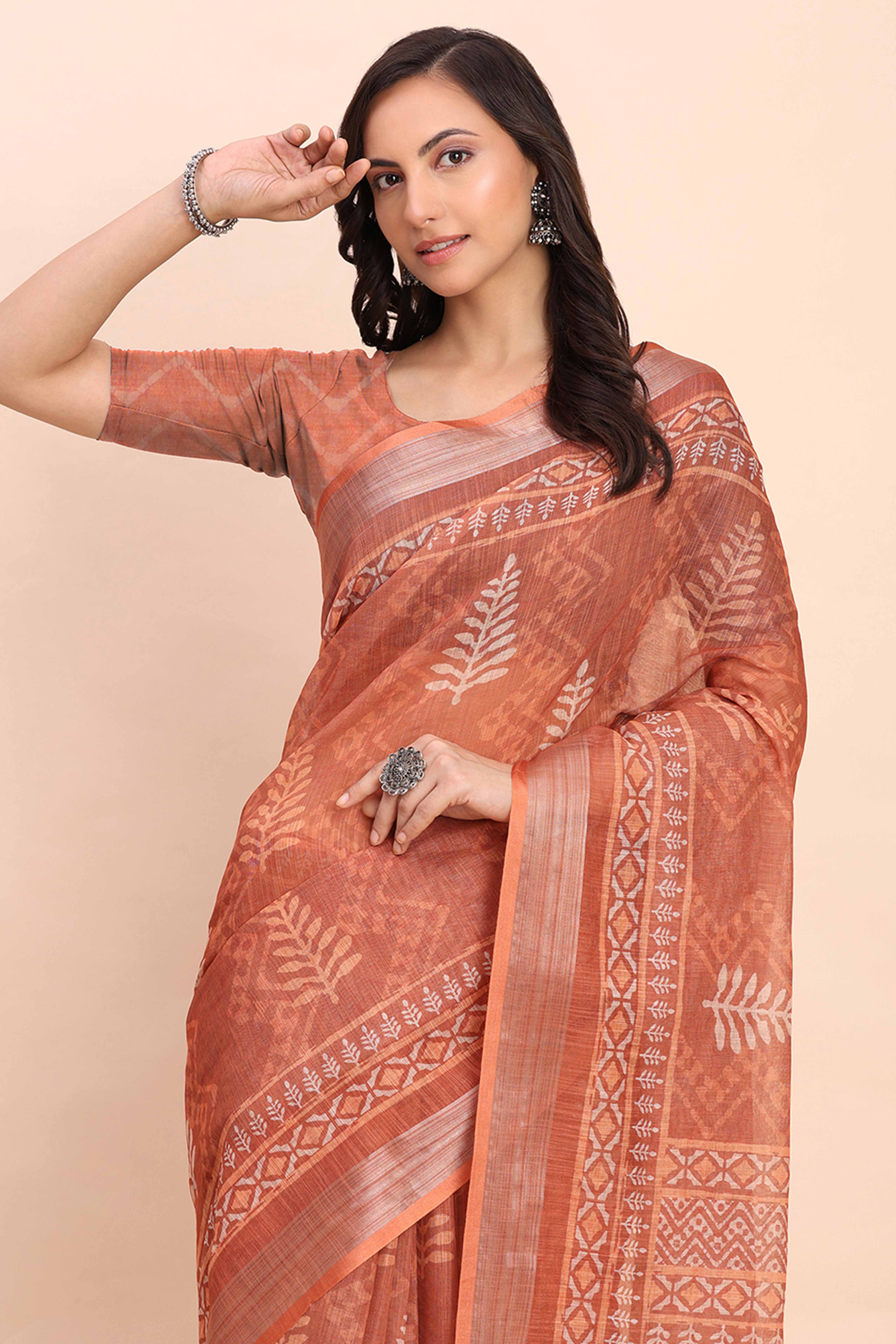 Rust Linen Saree with Intricate Silver Weaving