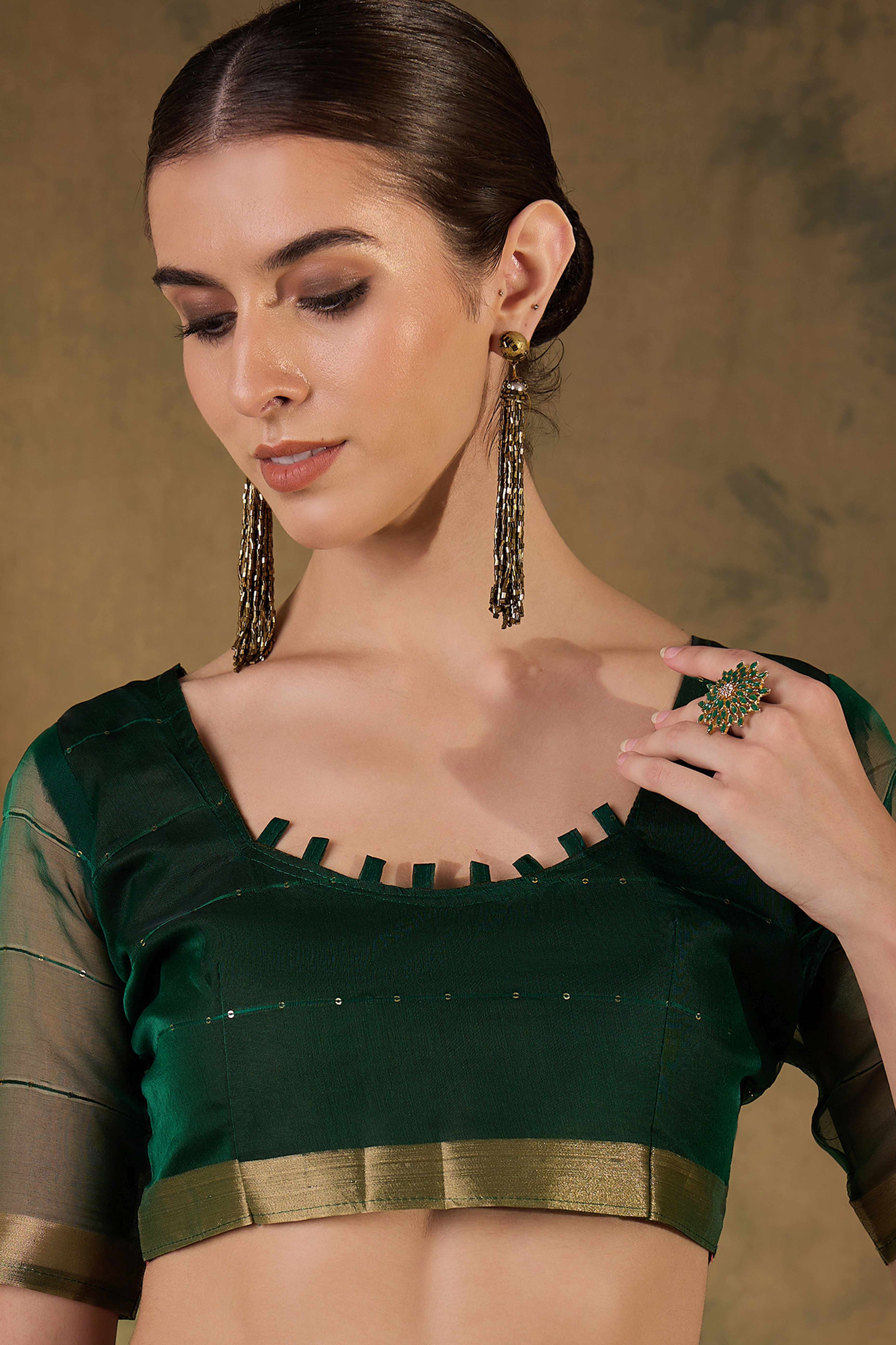 Green Organza Silk Saree Featuring Shimmering Sequins Embroidery & Elegant Tasselled Pallu