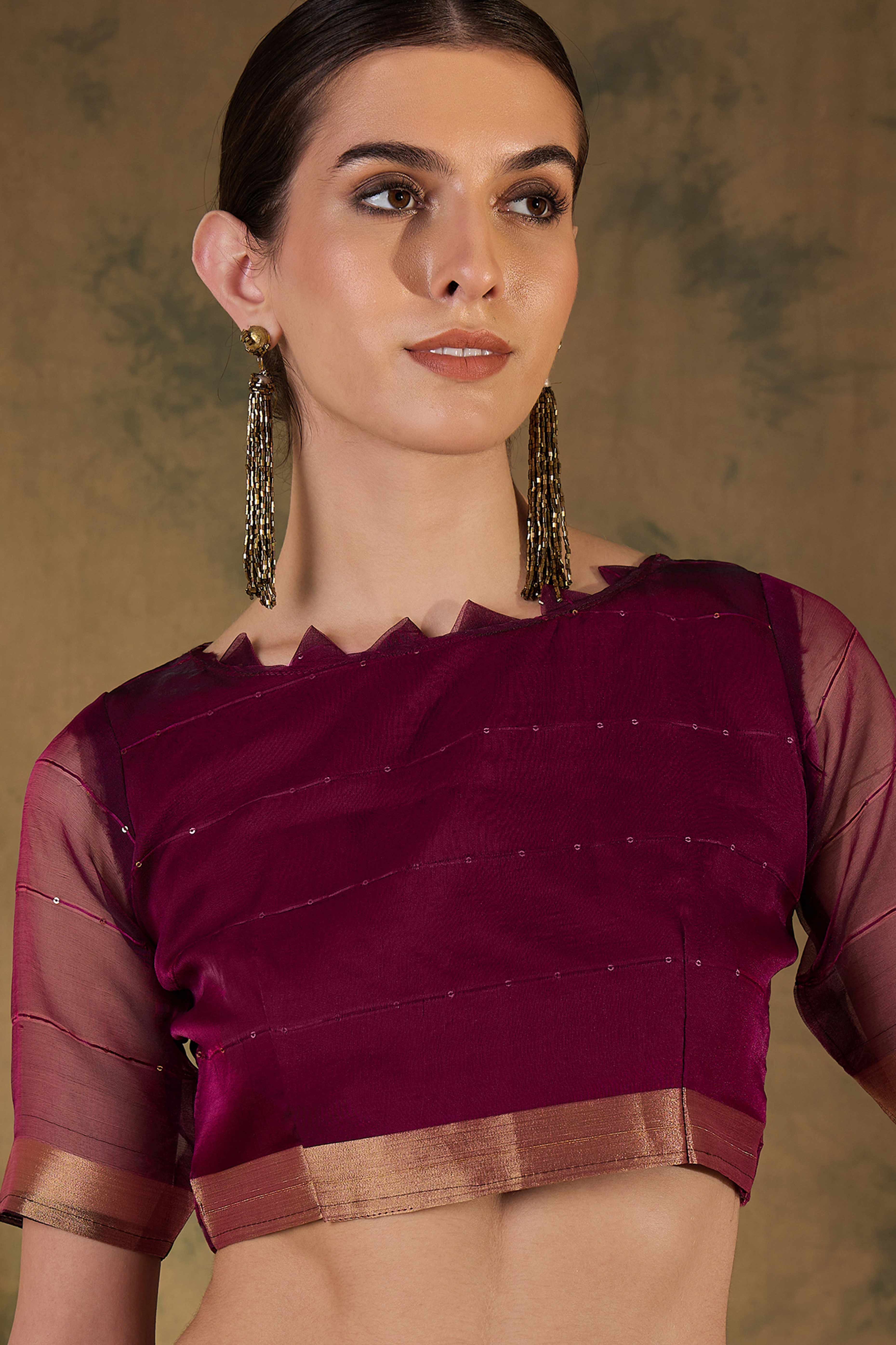 Wine Organza Silk Saree Featuring Shimmering Sequins Embroidery & Elegant Tasselled Pallu