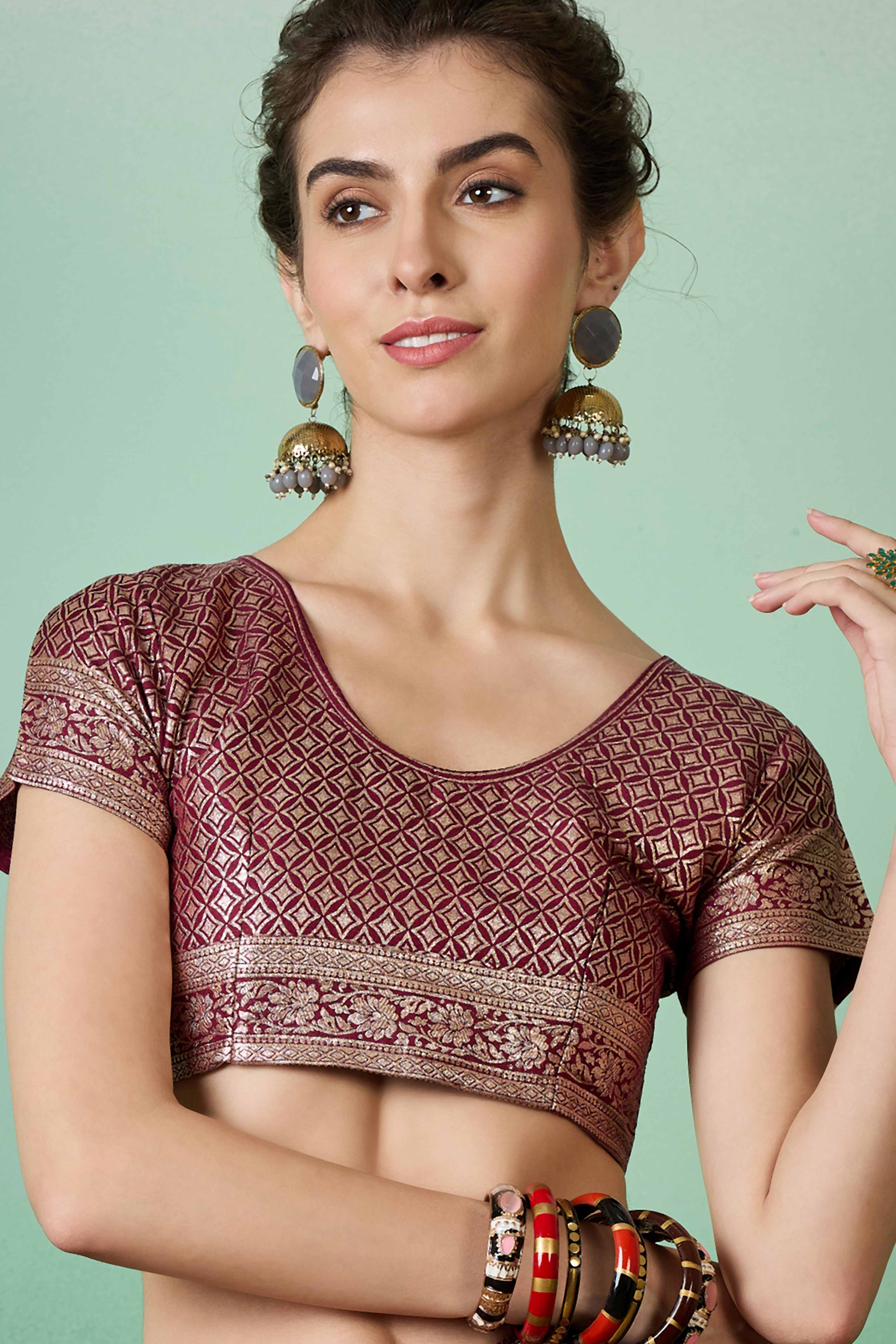 Wine Cotton Blend Saree Adorned With Floral Zari Weaving & Soft Tassel Accents