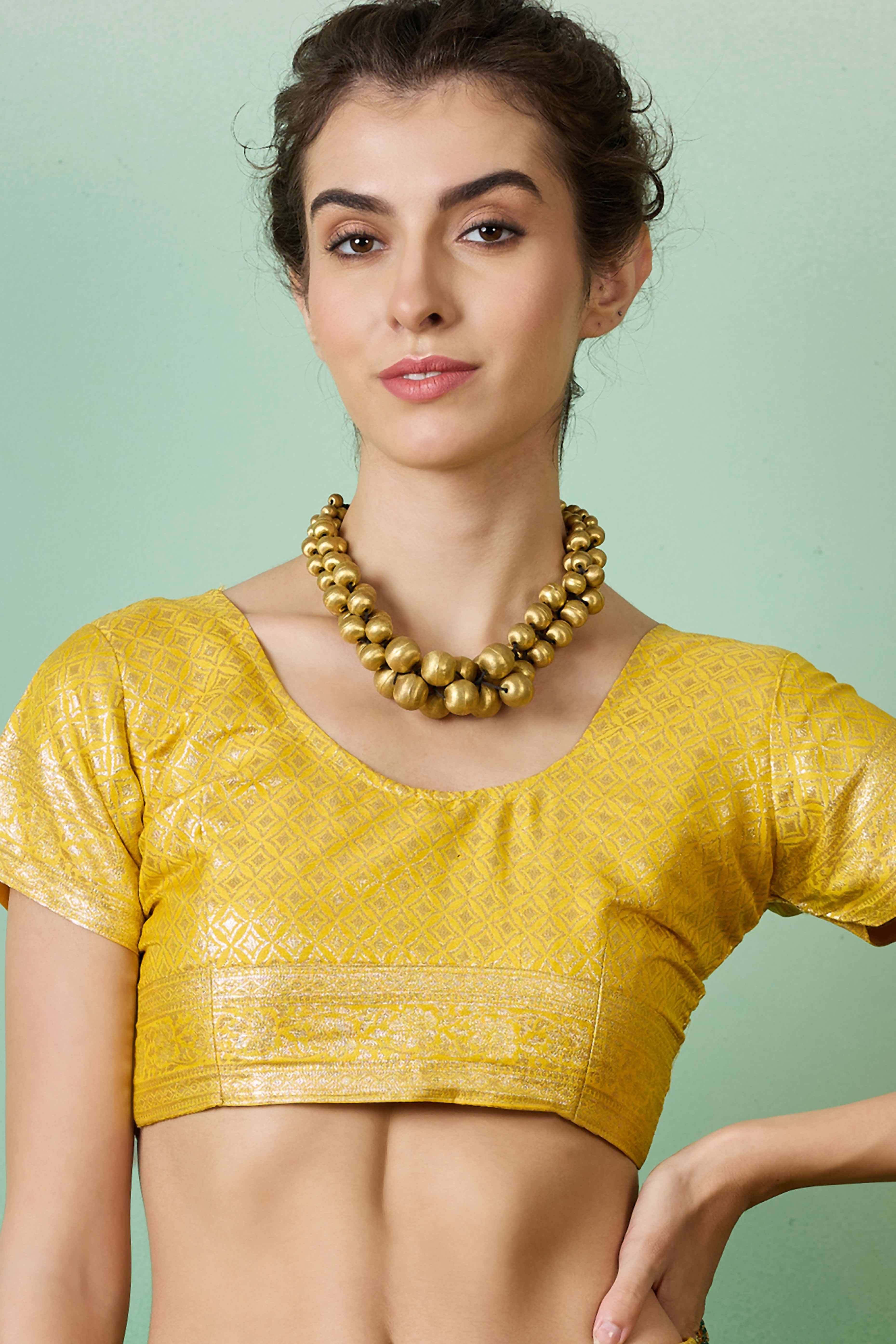 Yellow Cotton Blend Saree Adorned With Floral Zari Weaving & Soft Tassel Accents