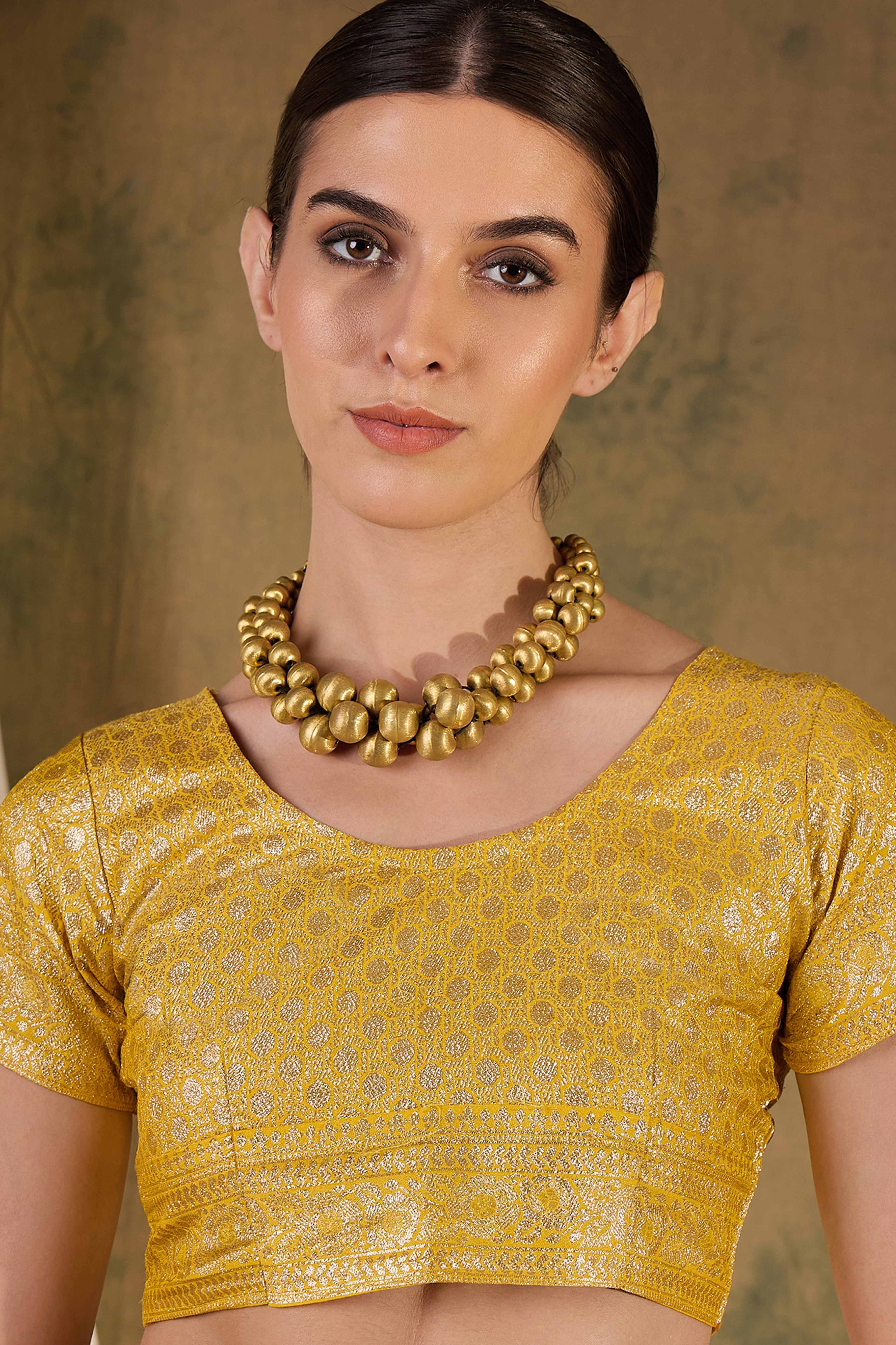 Yellow Cotton Blend Saree Embellished With Floral Zari Weaving & Tasselled Pallu