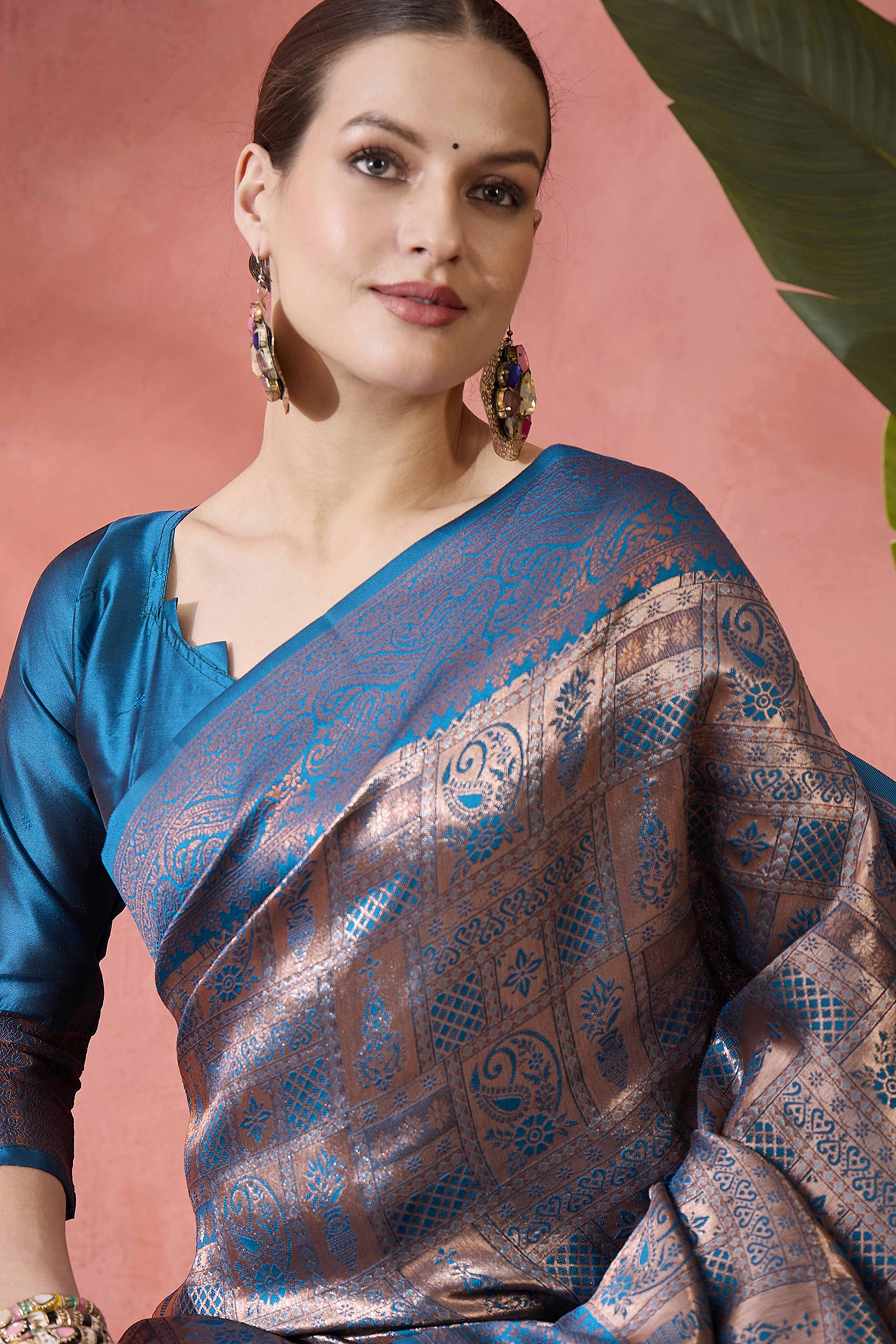 Blue Woven Poly Silk Blend Saree Featuring Floral & Paisley Motifs With Tassel Accents
