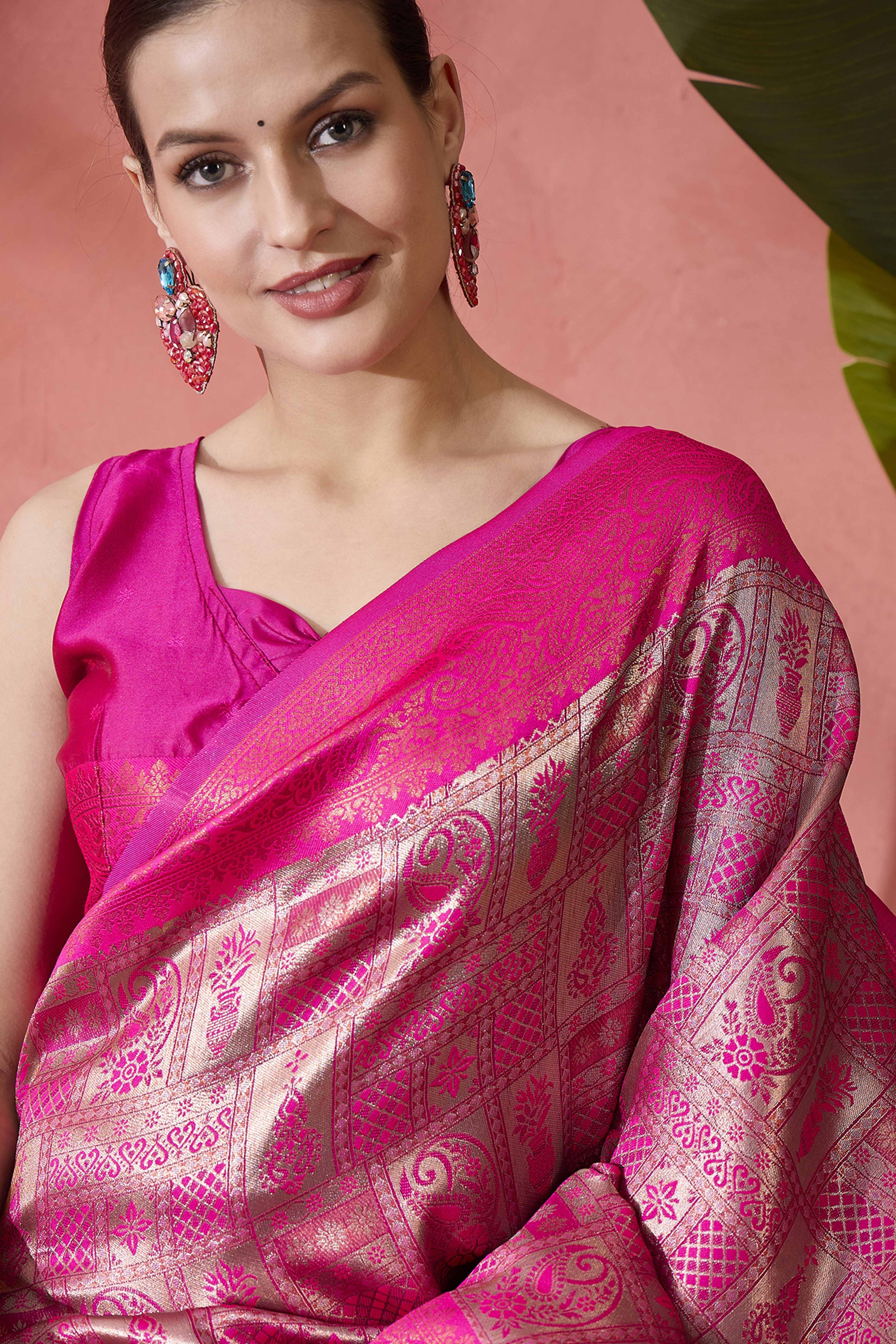 Rani Pink Woven Poly Silk Blend Saree Featuring Floral & Paisley Motifs With Tassel Accents