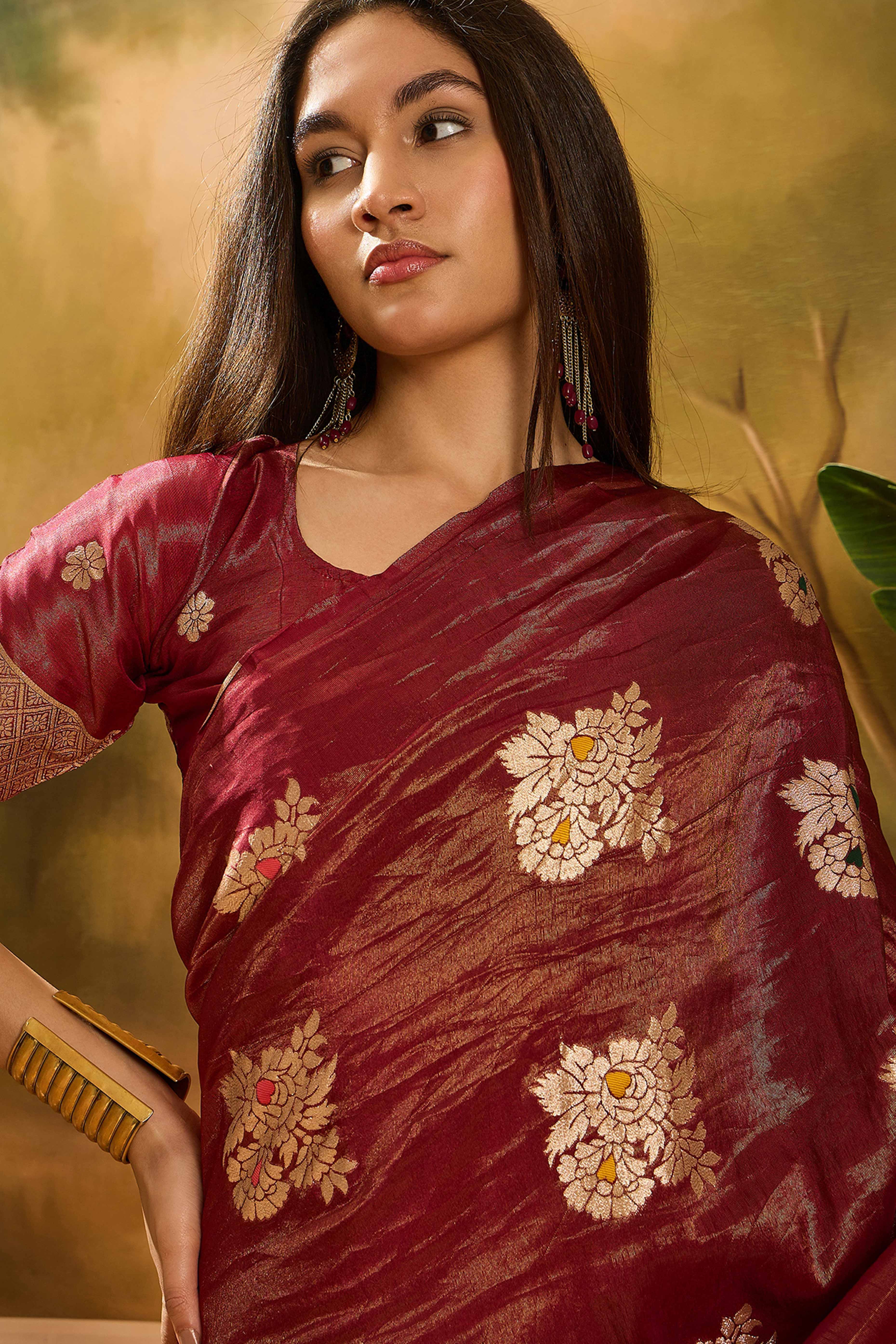 Maroon Saree In Shimmer Fabric With Floral Zari Weaving & Decorative Tassel Pallu