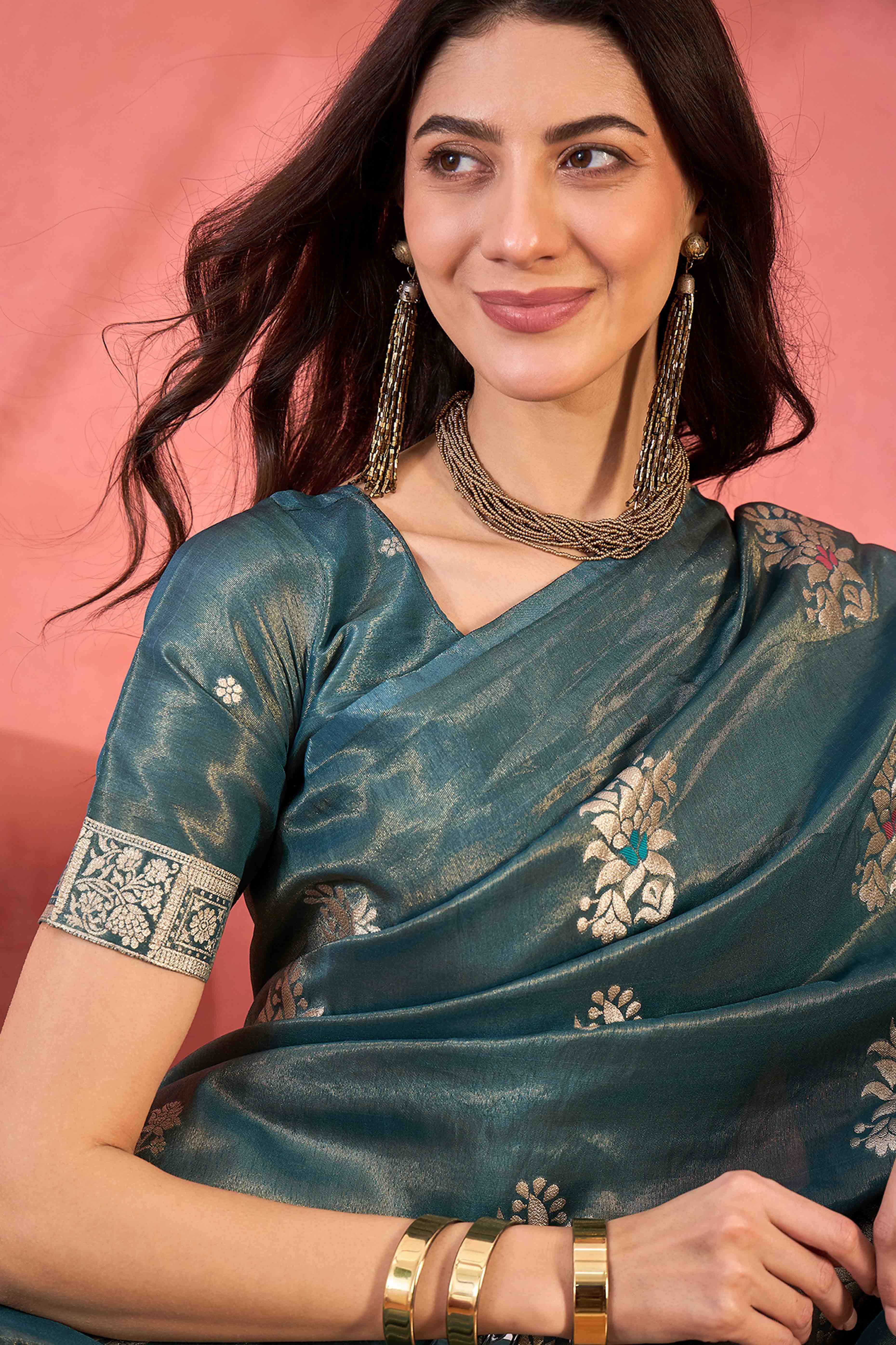 Teal Shimmer Saree Showcasing Floral Zari Weaving & A Tasselled Pallu