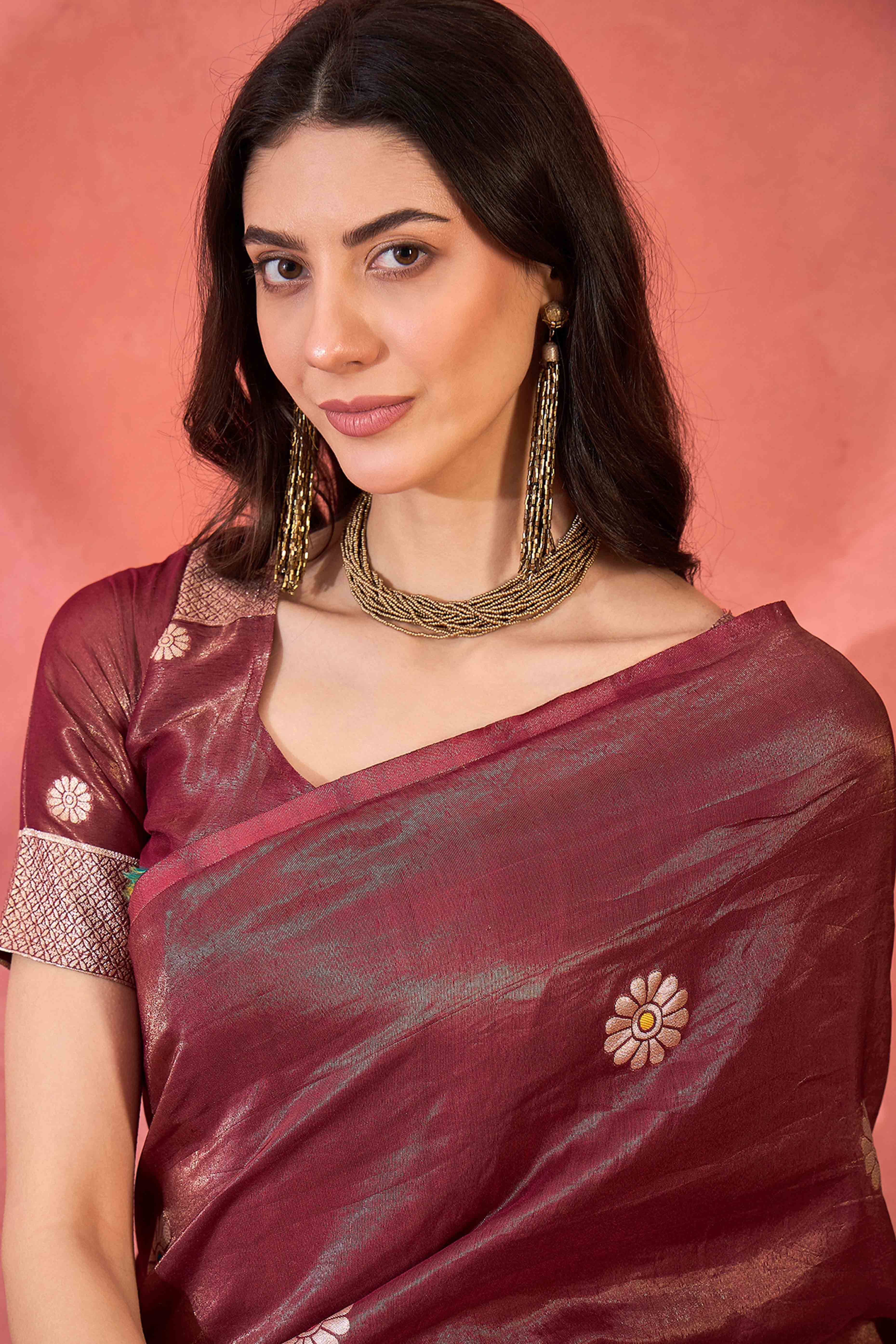 Maroon Shimmer Saree Adorned with Floral Zari Weaving & Tassel Pallu