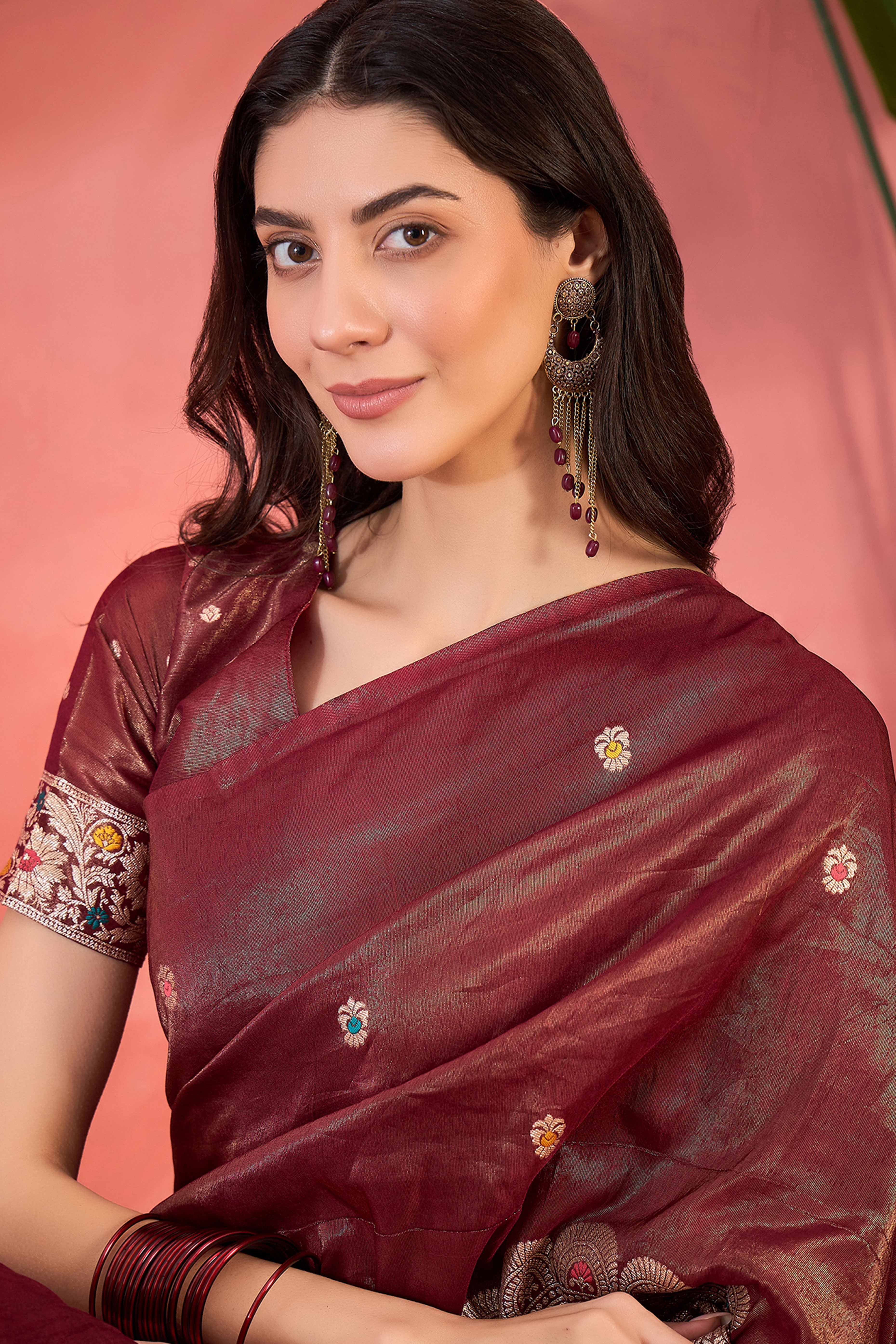 Maroon Zari Woven Shimmer Saree With Floral Motifs & Flowing Tassel Pallu