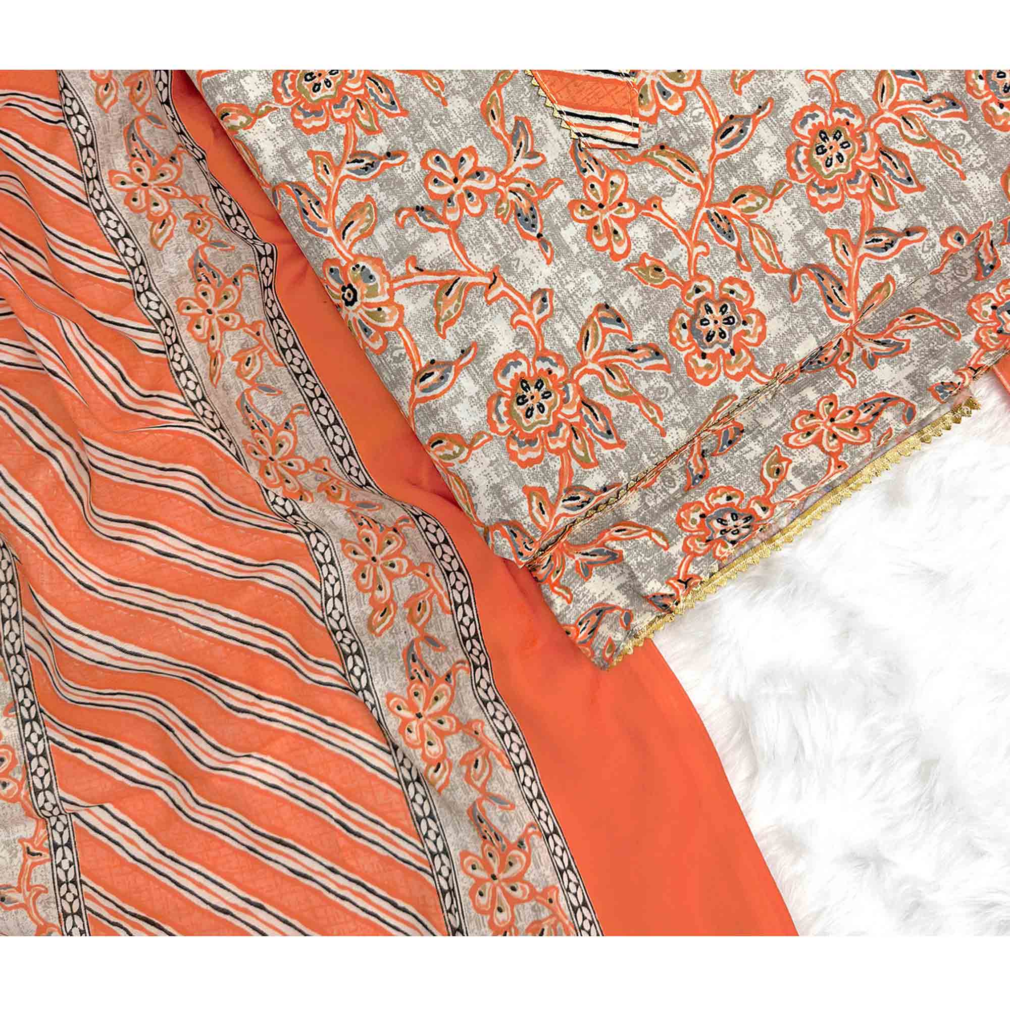 Charming Orange Floral Printed Cotton Blend Dress Material Featuring Intricate Lace Border