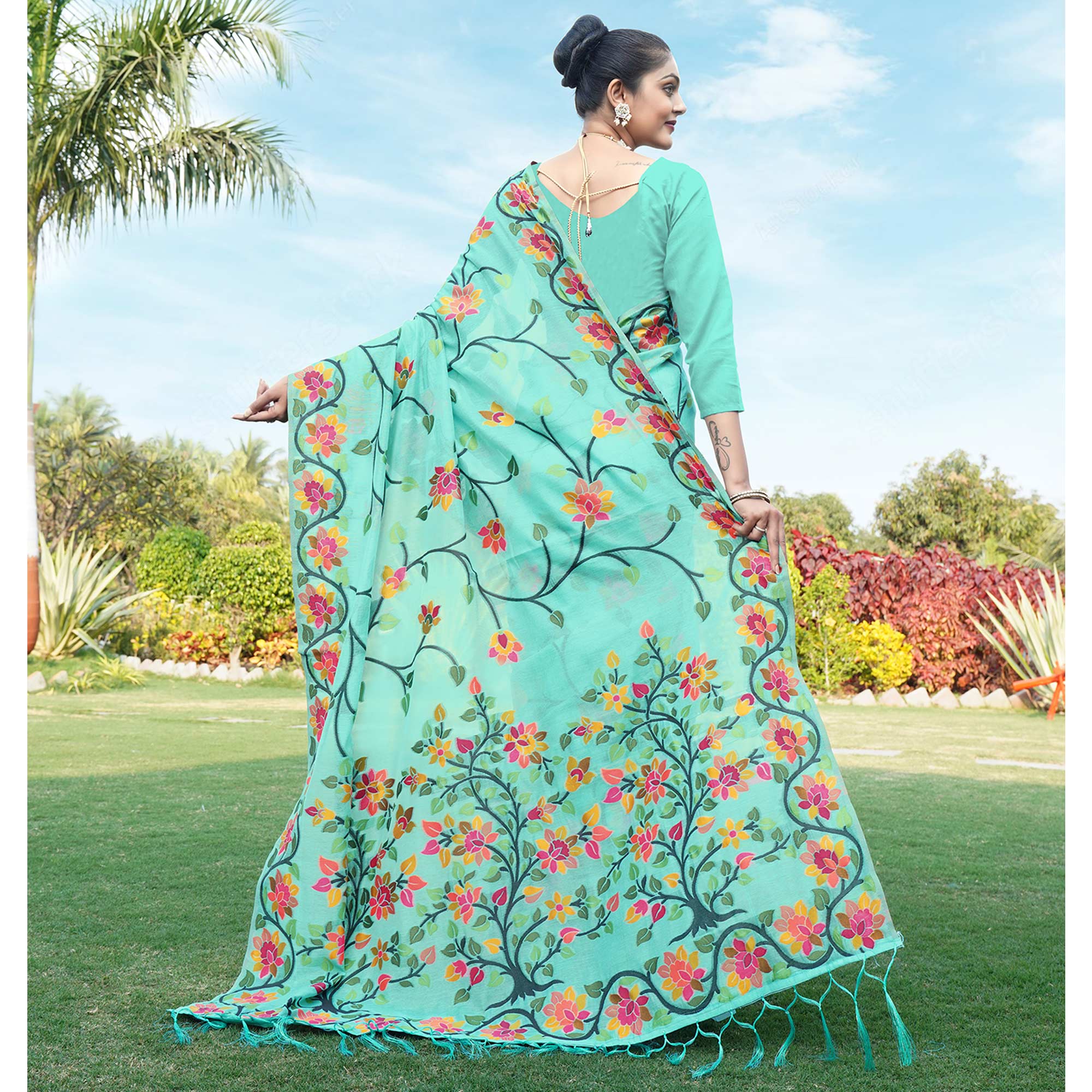 Turquoise Floral Woven Cotton Silk Saree With Tassels