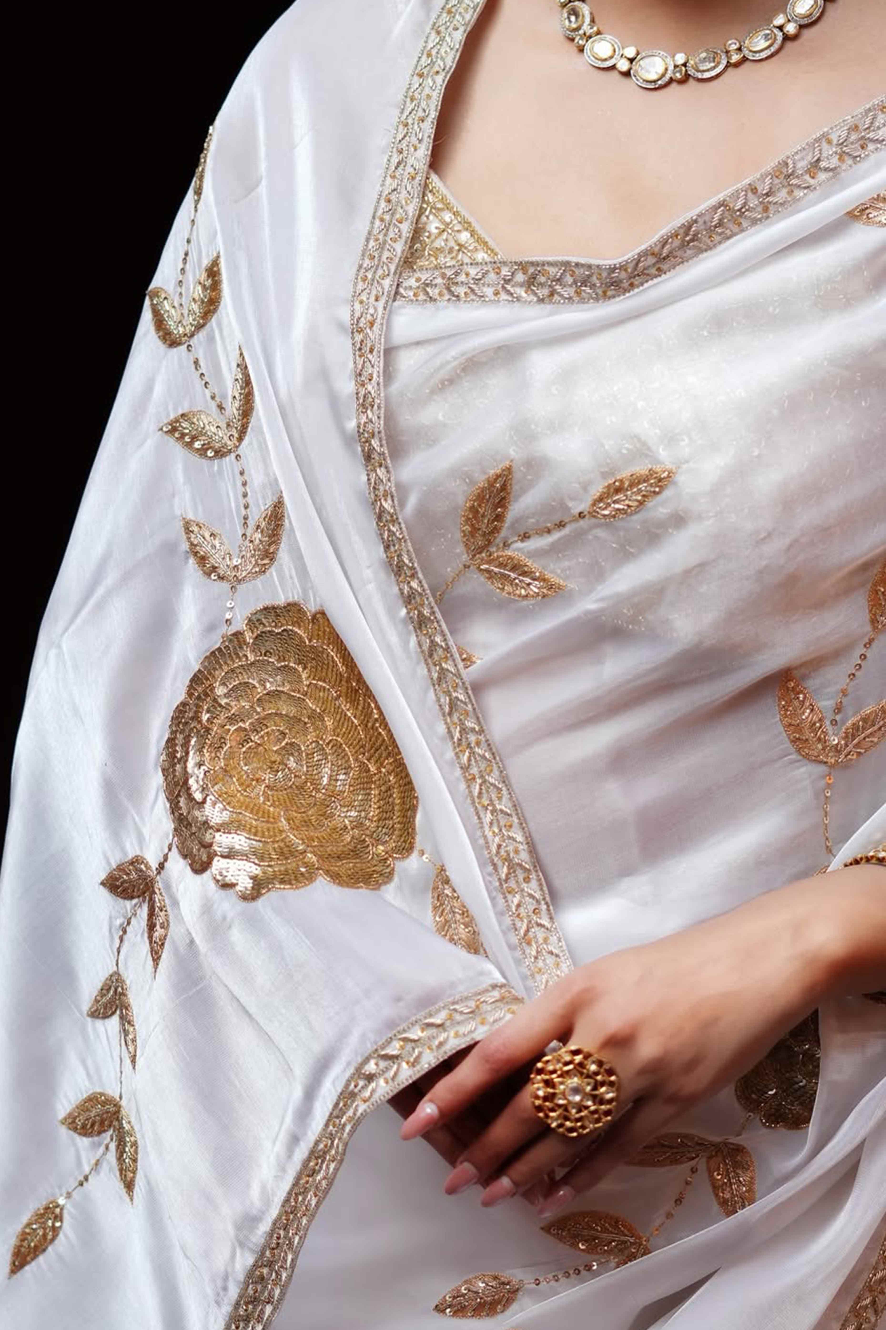 White Silk Blend Saree Featuring Delicate Floral Motifs in Shimmering Sequins