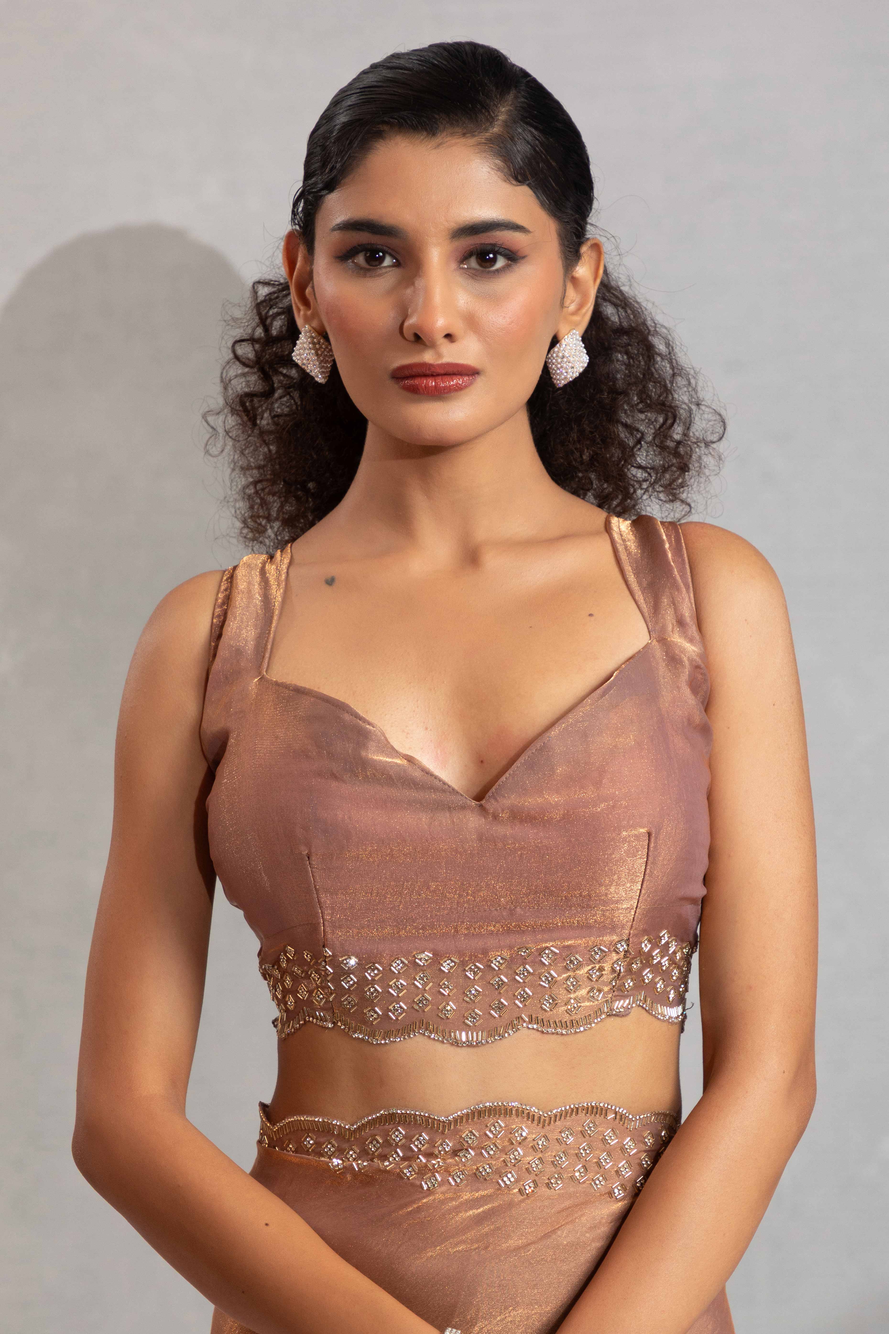 Shimmery Brown Satin Saree with Glamorous Stone Embellishment